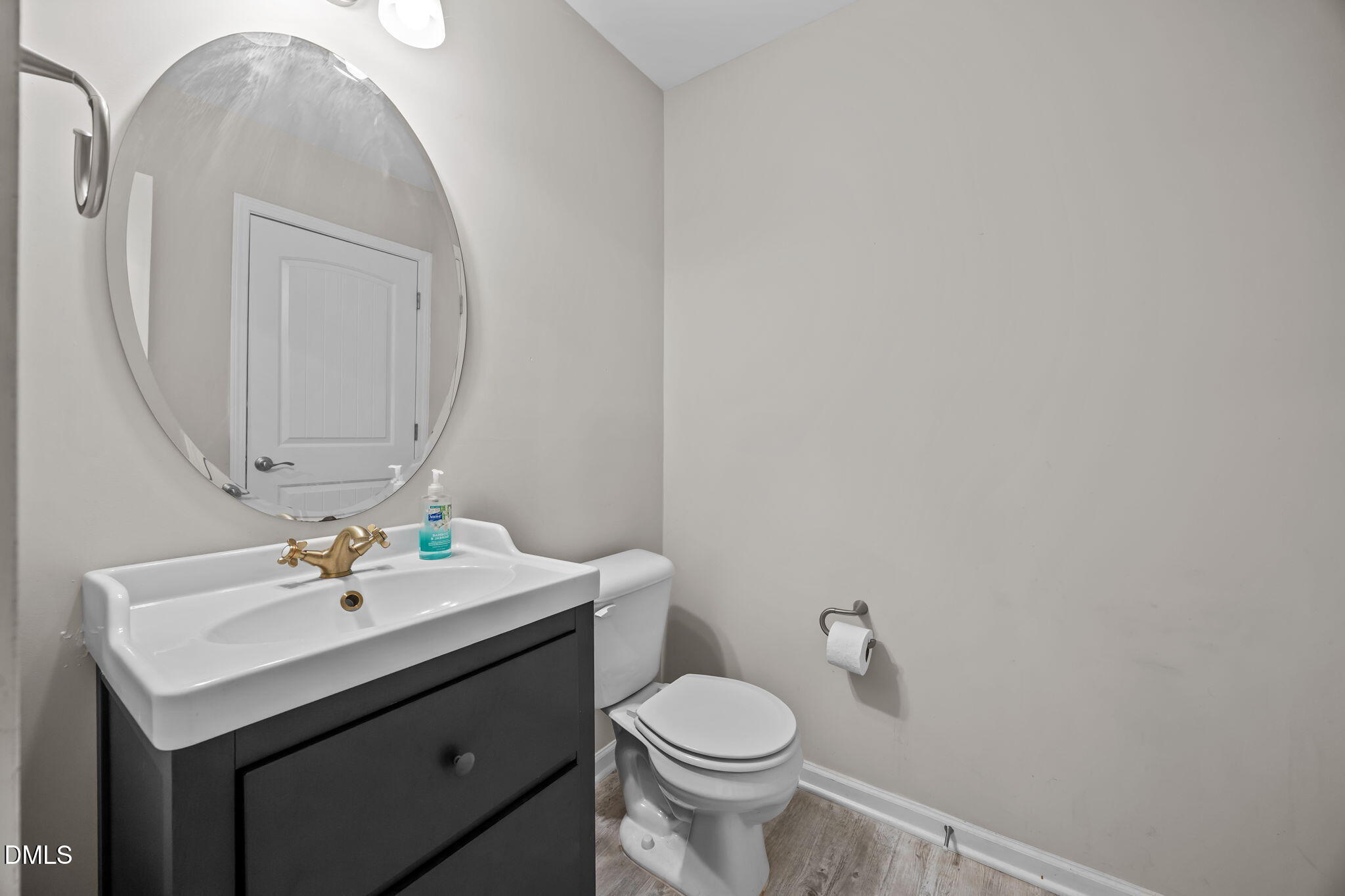 221 Socket Street Raleigh, NC 27606 - Photo 11 of 28 a bathroom with a sink toilet and mirror