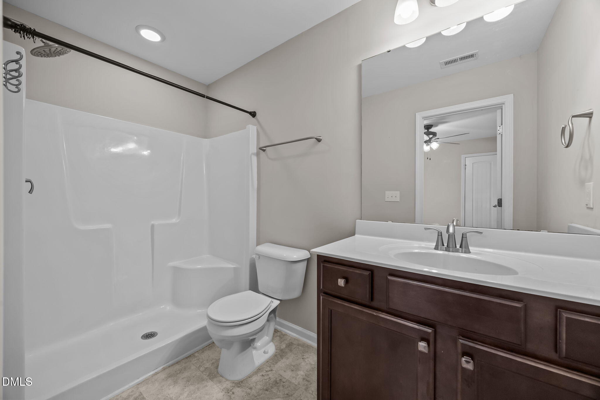 221 Socket Street Raleigh, NC 27606 - Photo 16 of 28 a bathroom with a sink a toilet and shower