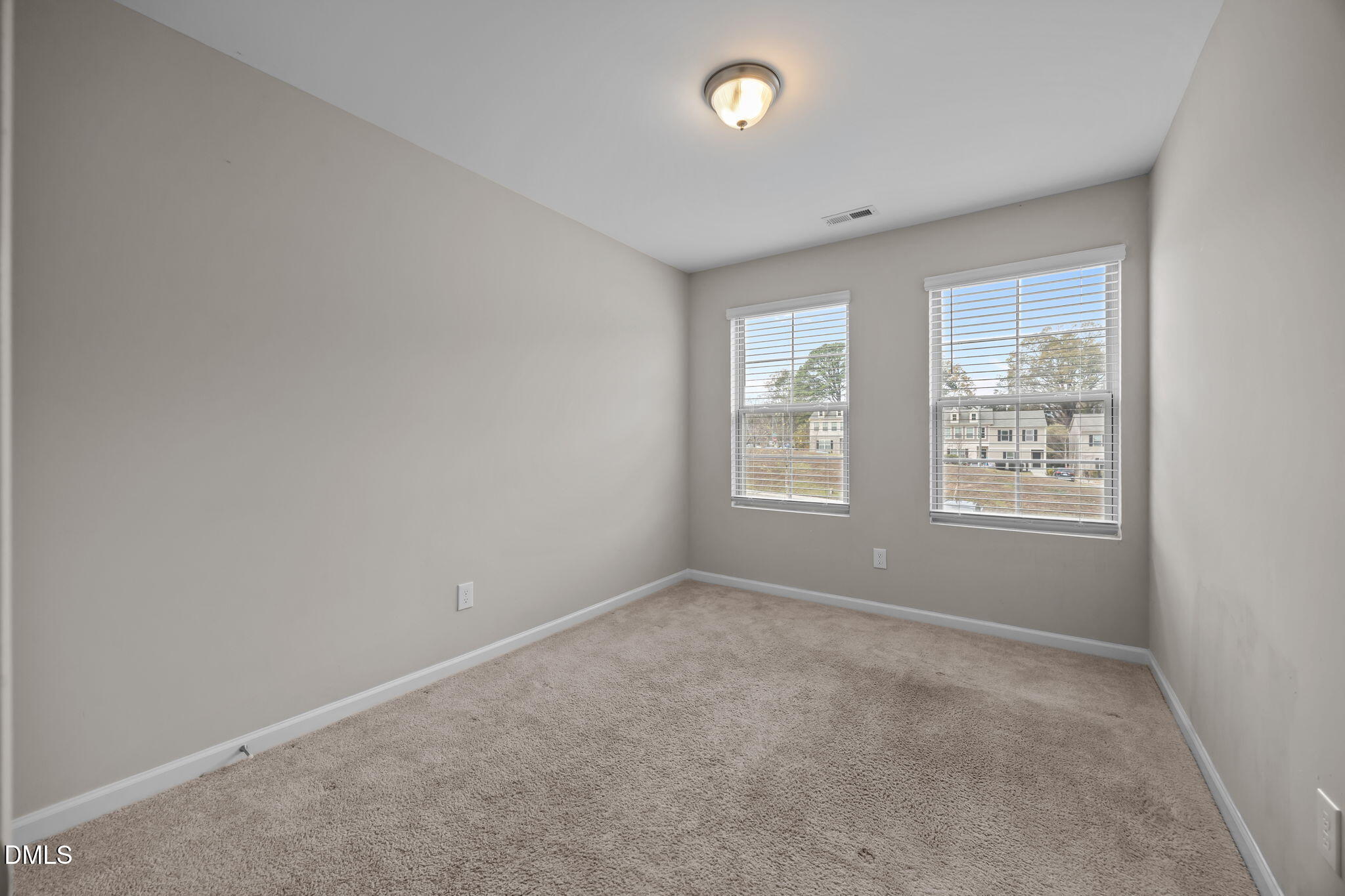 221 Socket Street Raleigh, NC 27606 - Photo 17 of 28 an empty room with windows