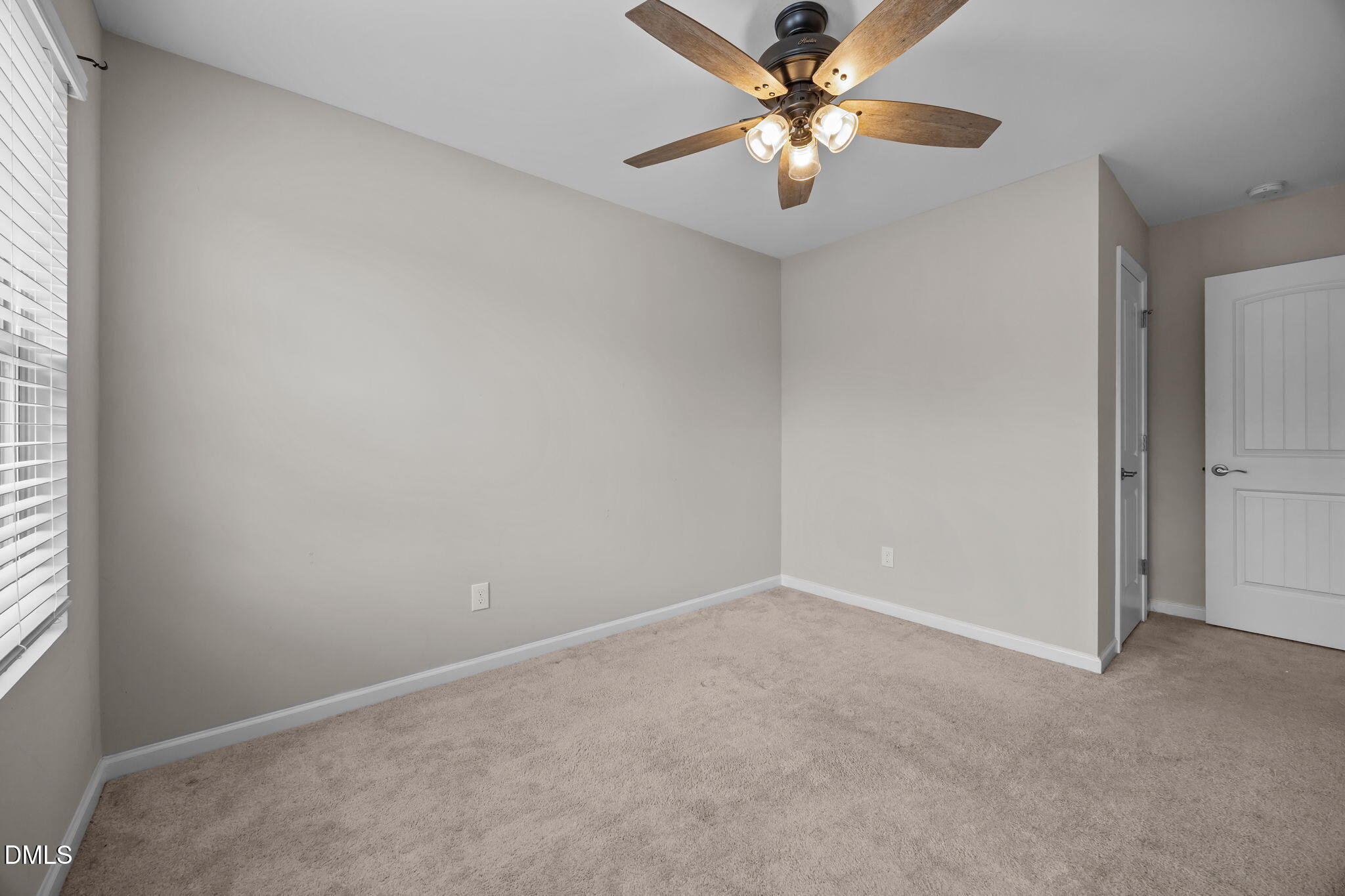 221 Socket Street Raleigh, NC 27606 - Photo 20 of 28 an empty room with windows and fan