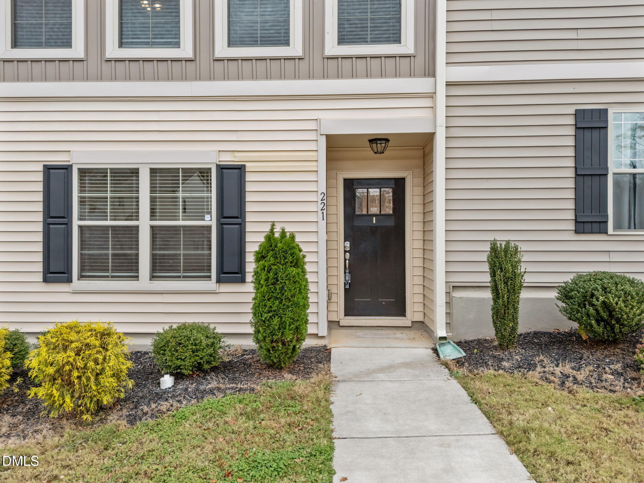 221 Socket Street Raleigh, NC 27606 - Photo 2 of 28 a front view of a house with a garden