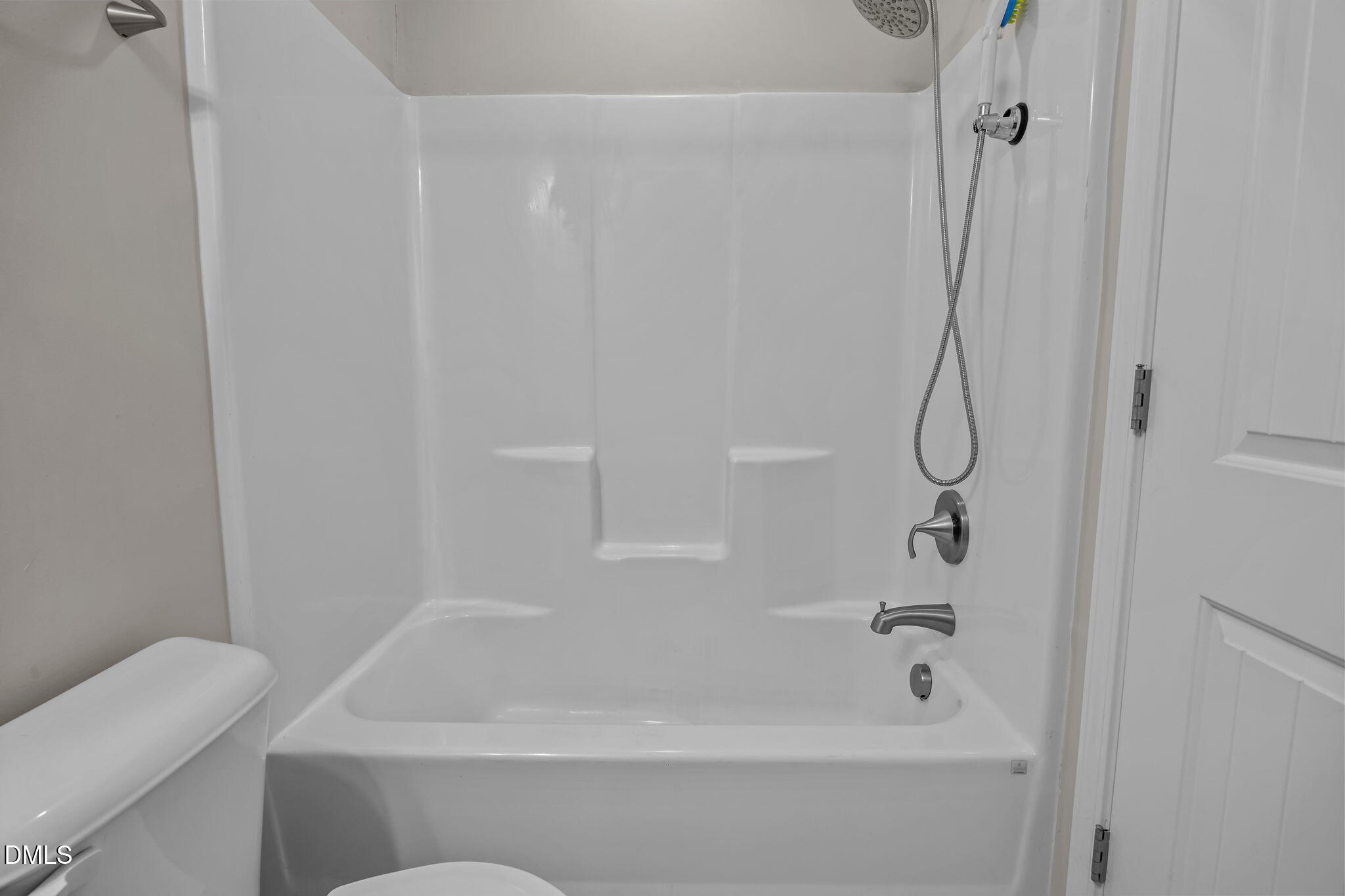 221 Socket Street Raleigh, NC 27606 - Photo 22 of 28 a bathroom with a tub and a shower