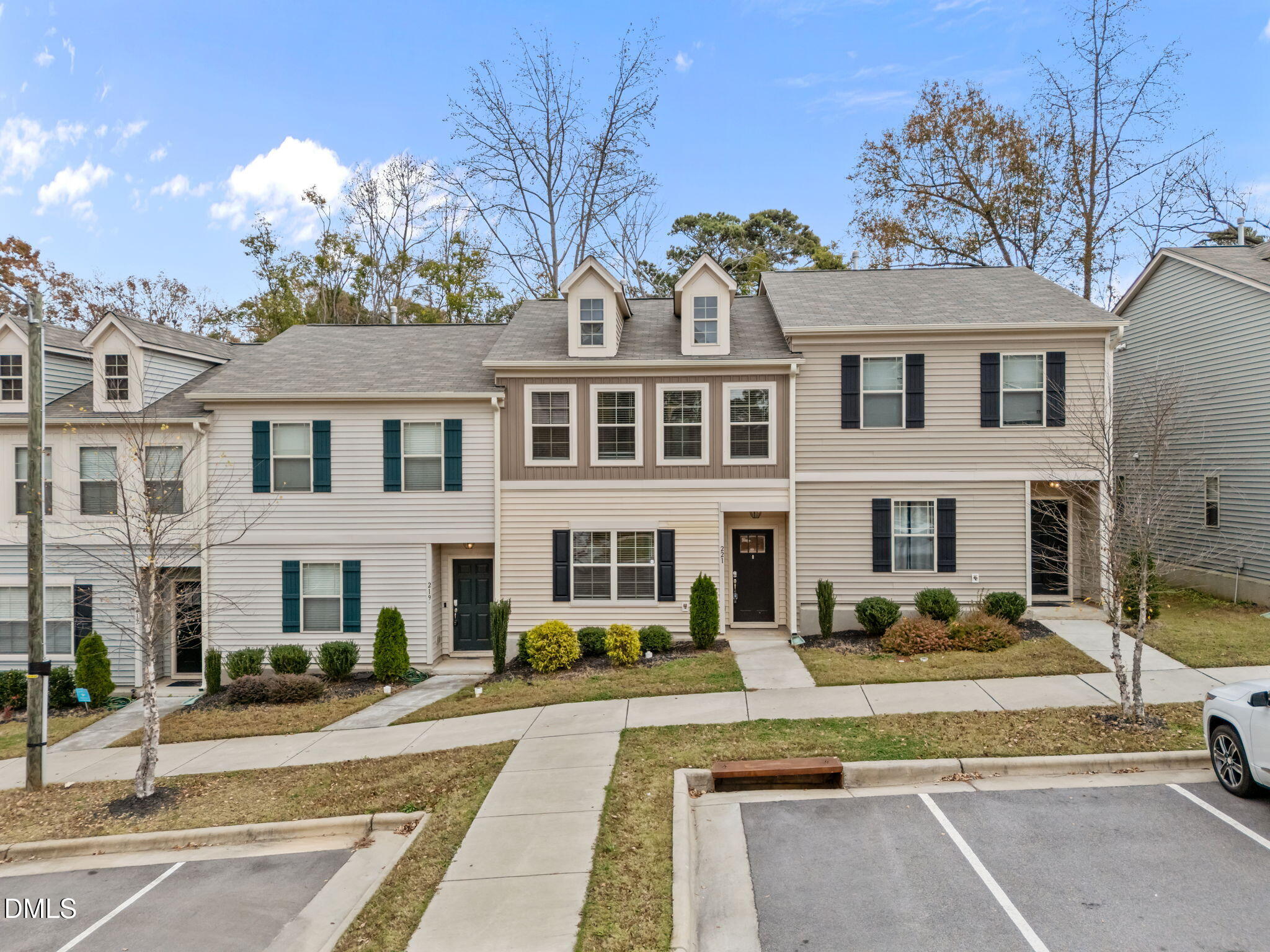 221 Socket Street Raleigh, NC 27606 - Photo 25 of 28 a front view of a residential apartment building with a yard