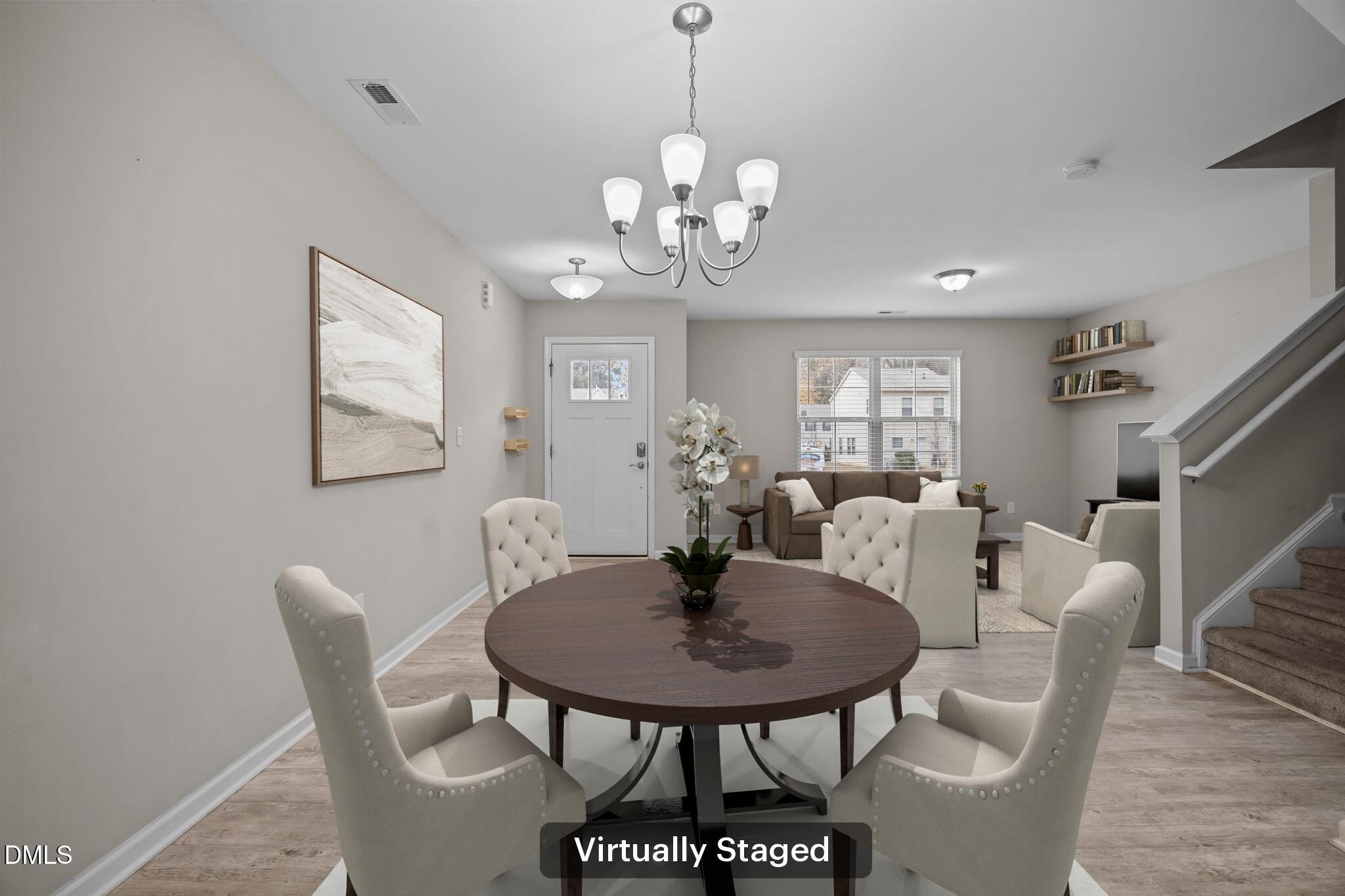 221 Socket Street Raleigh, NC 27606 - Photo 7 of 28 a view of a dining room with furniture and wooden floor