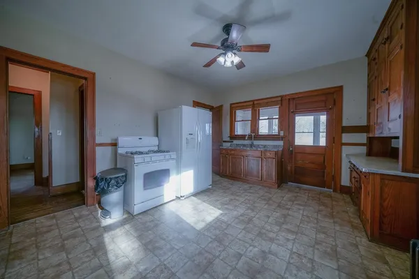a view of a kitchen with a stove cabinets and a kitchen