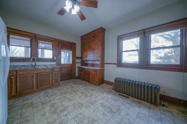 a large kitchen with a large window