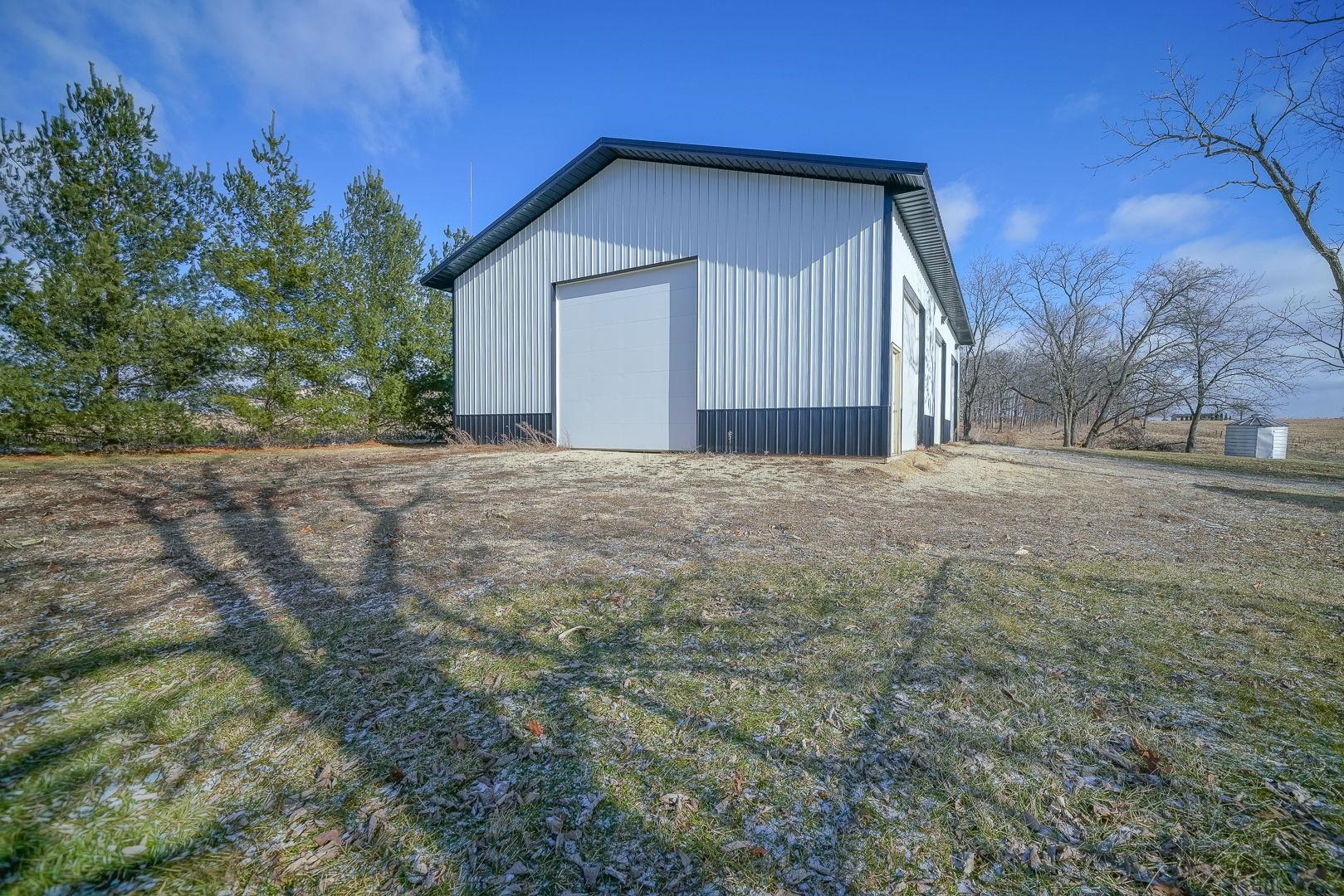6259 North Pecatonica Road Pecatonica, IL 61063 - Photo 29 of 48 a view of a house with a yard