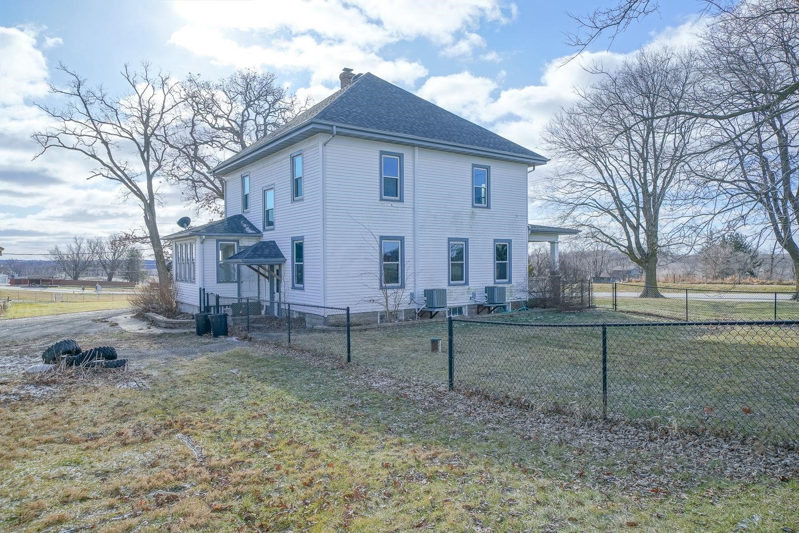 6259 North Pecatonica Road Pecatonica, IL 61063 - Photo 33 of 48 a view of house with backyard space and tree