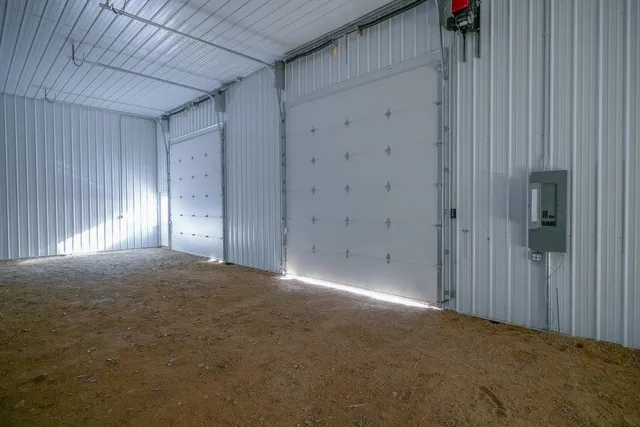 a view of house with backyard space and tree