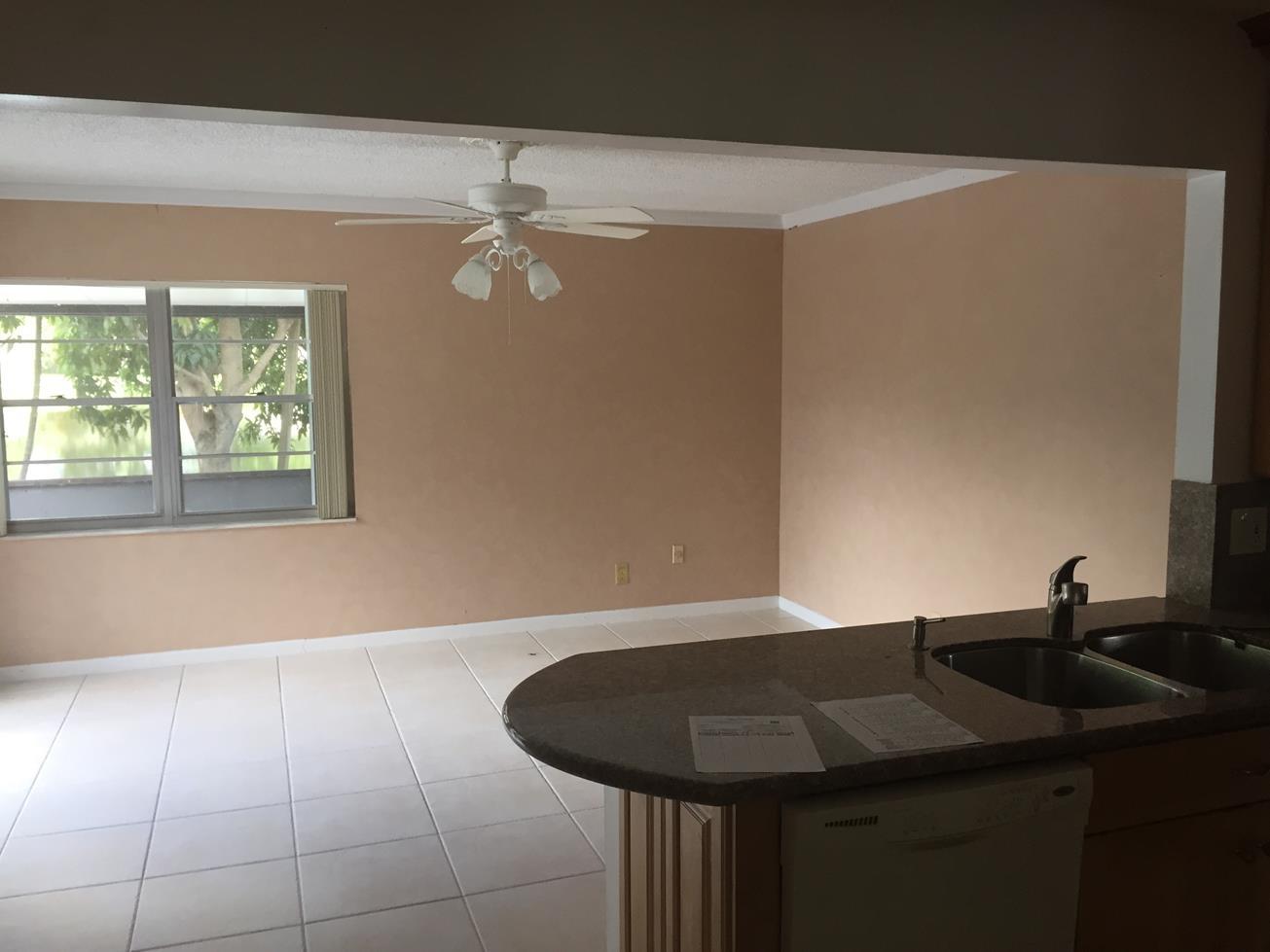 9276 Saddlebrook Drive Boca Raton, FL 33496 - Photo 6 of 10 a bathroom with a sink and a mirror