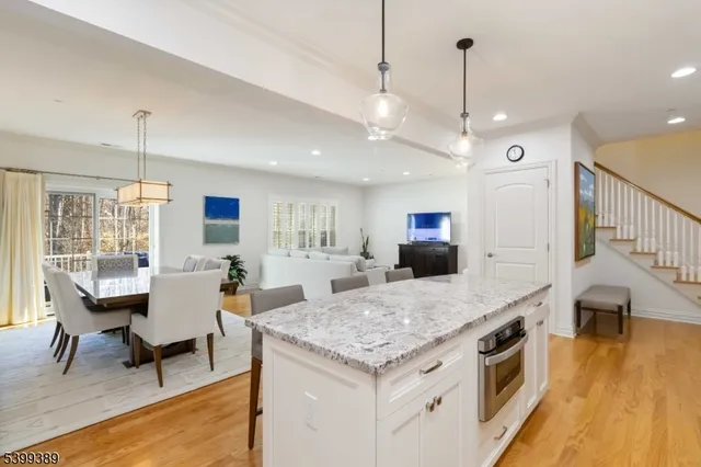 a spacious bedroom with a bed and a window