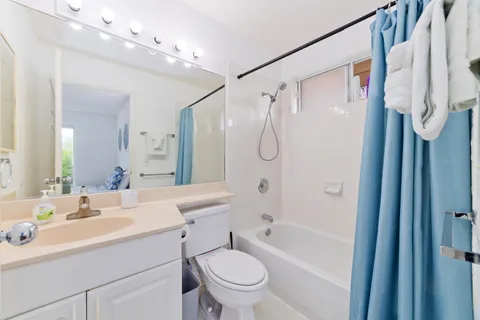 a view of a bathroom with shower
