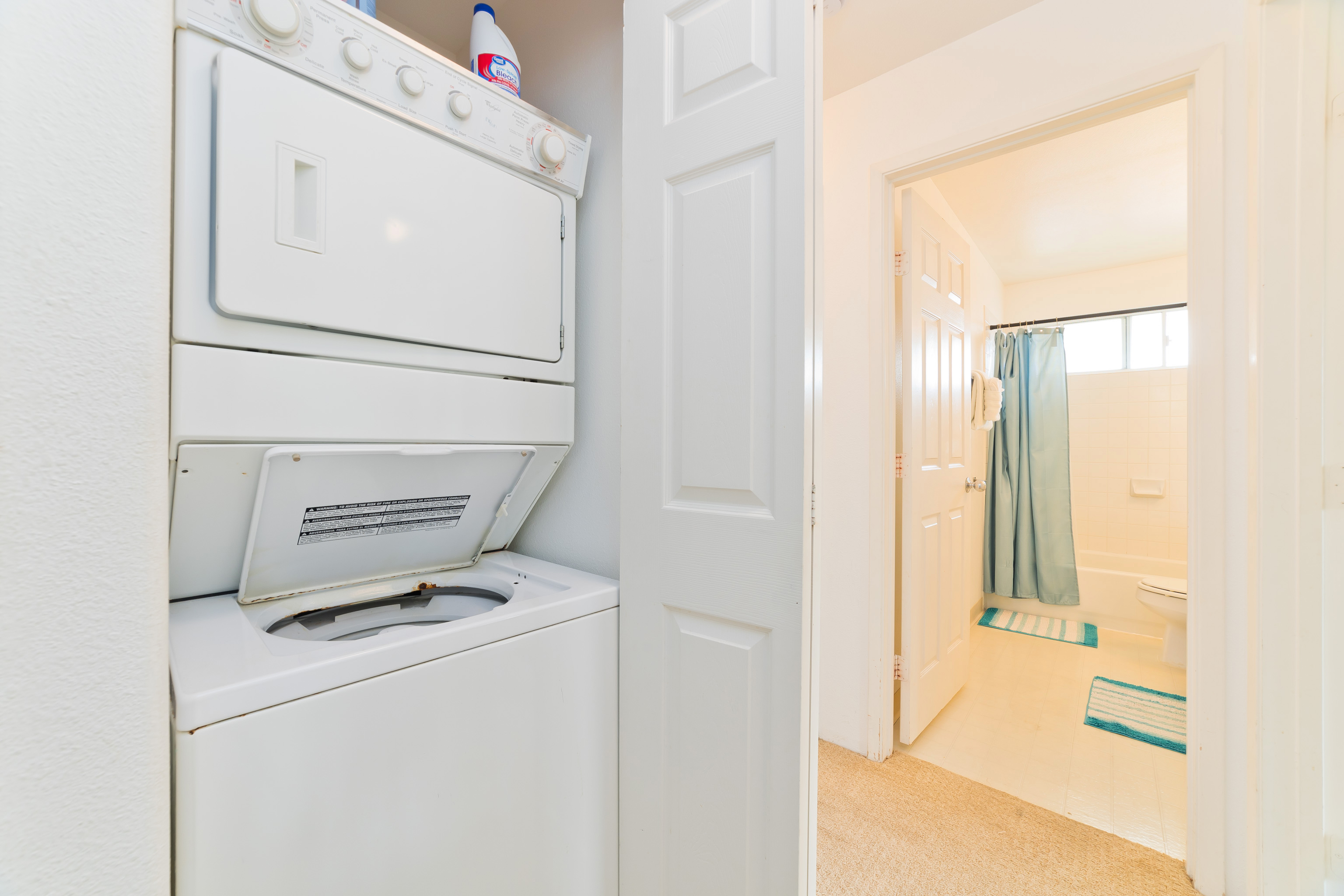 75-6081 Alii Drive, Unit O201 Kailua-Kona, HI 96740 - Photo 22 of 28 a utility room with dryer and washer