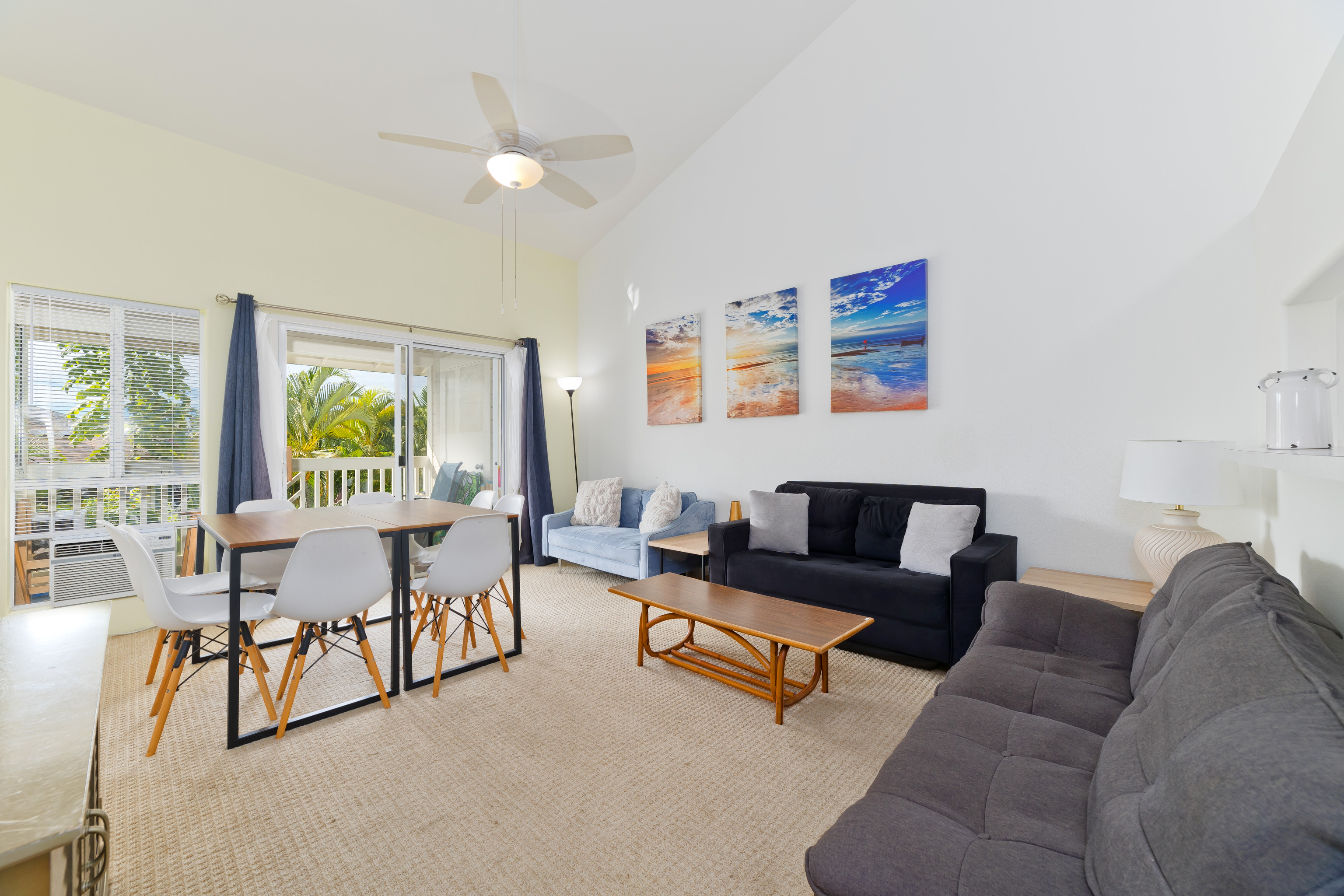 75-6081 Alii Drive, Unit O201 Kailua-Kona, HI 96740 - Photo 4 of 28 a living room with furniture and a large window