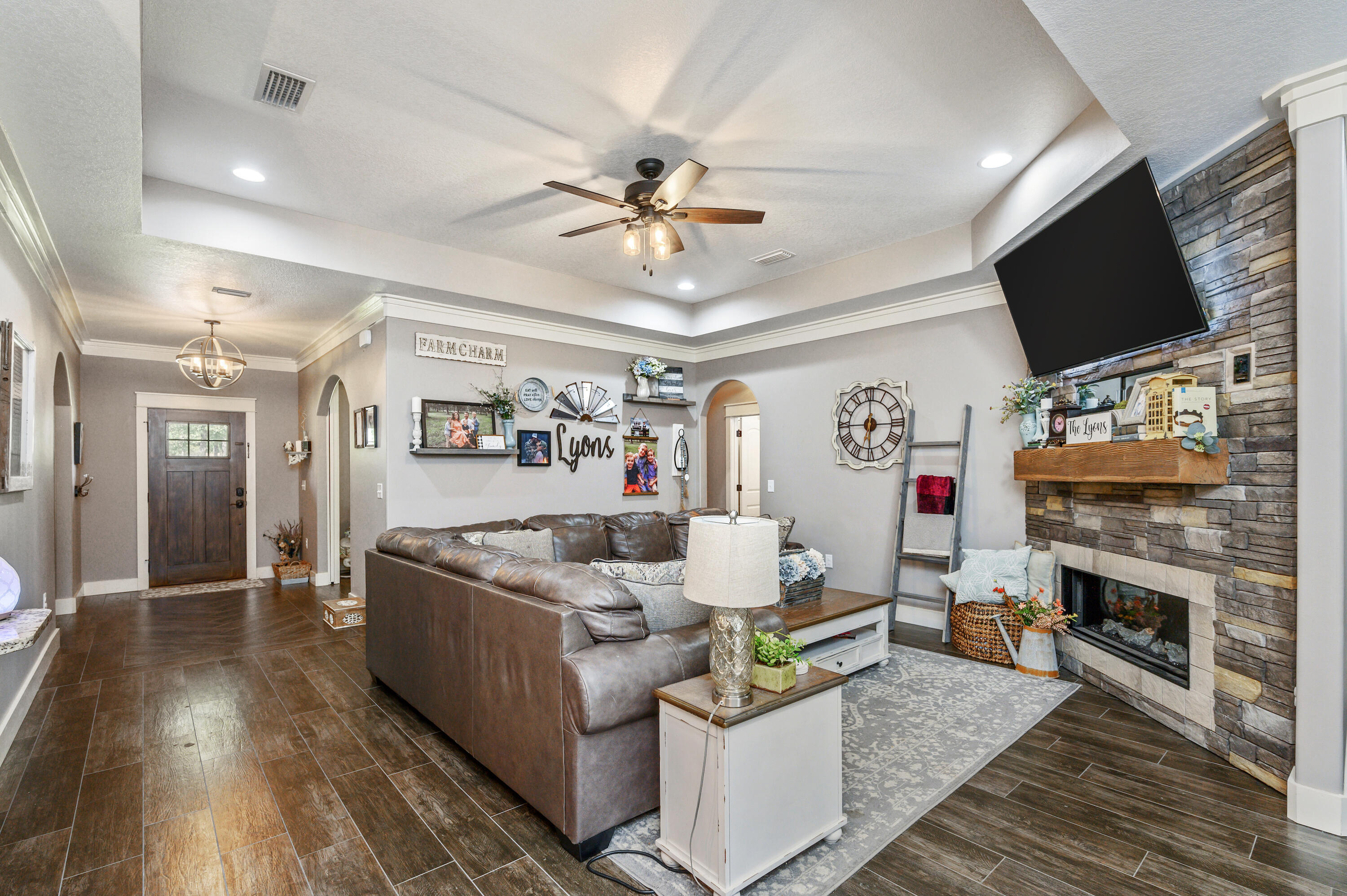 6053 Dairy Road Baker, FL 32531 - Photo 11 of 55 a living room with fireplace furniture and a flat screen tv