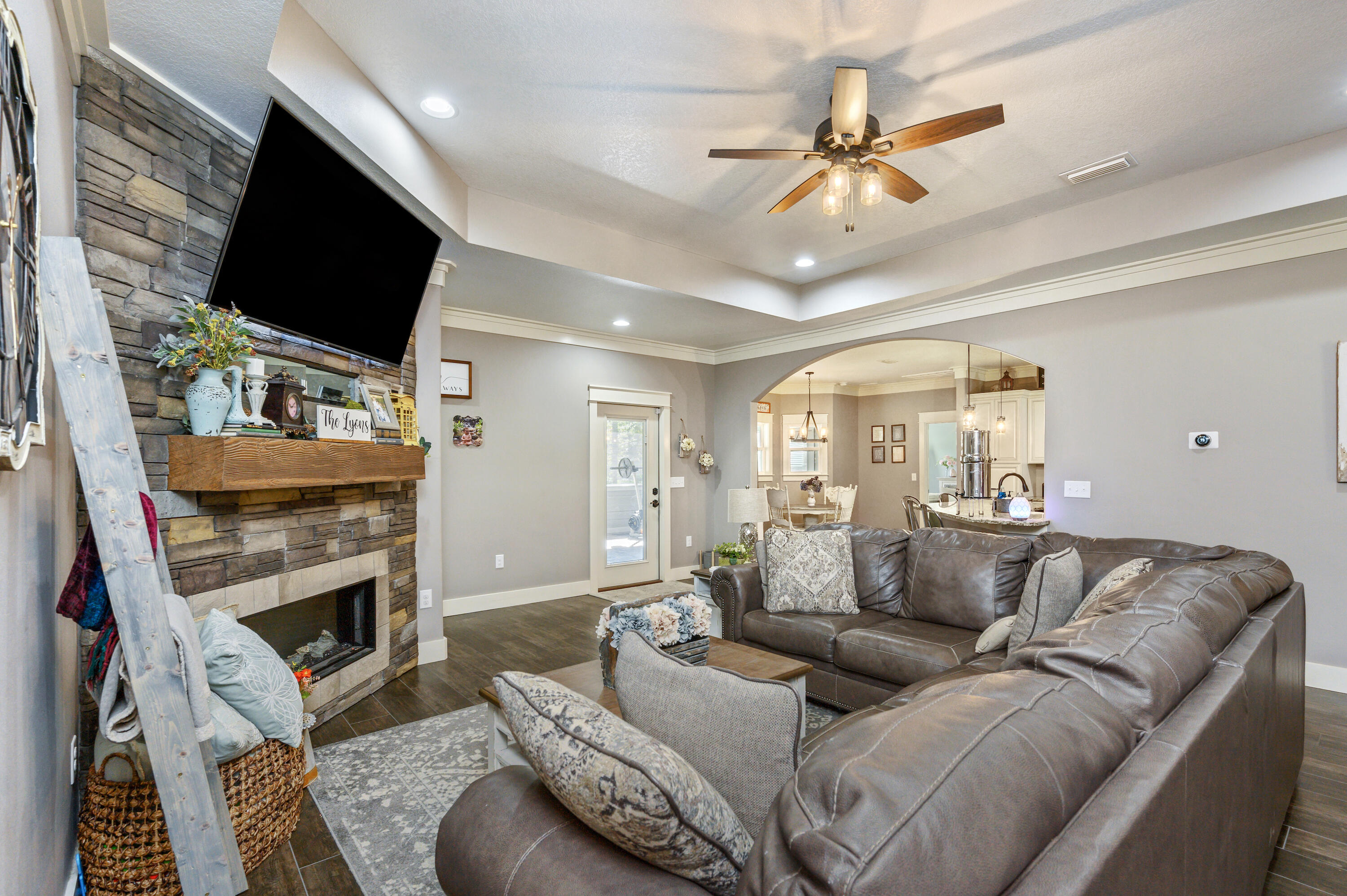 6053 Dairy Road Baker, FL 32531 - Photo 12 of 55 a living room with furniture a flat screen tv and a fireplace