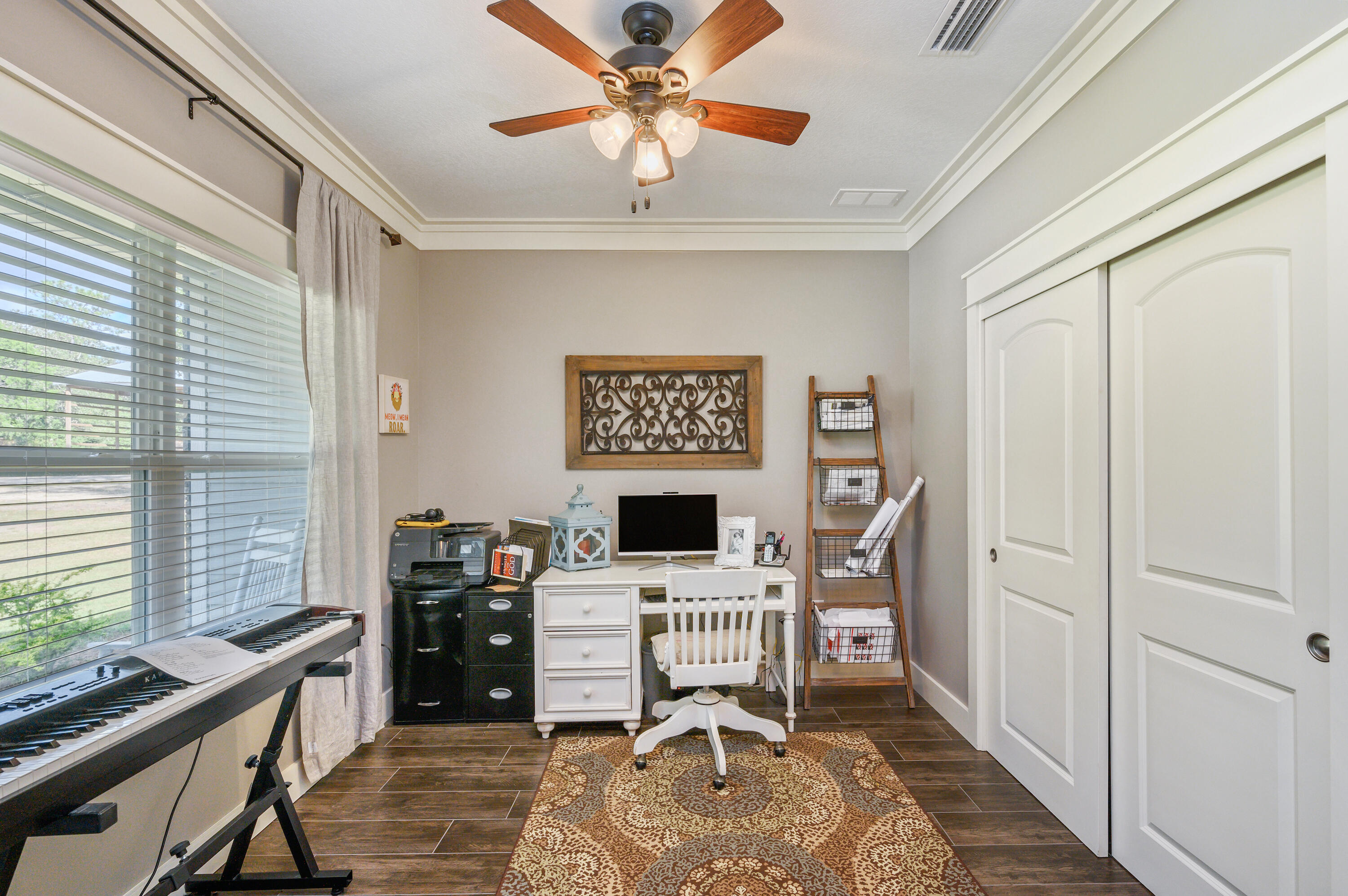 6053 Dairy Road Baker, FL 32531 - Photo 13 of 55 a view of a workspace with furniture and a window