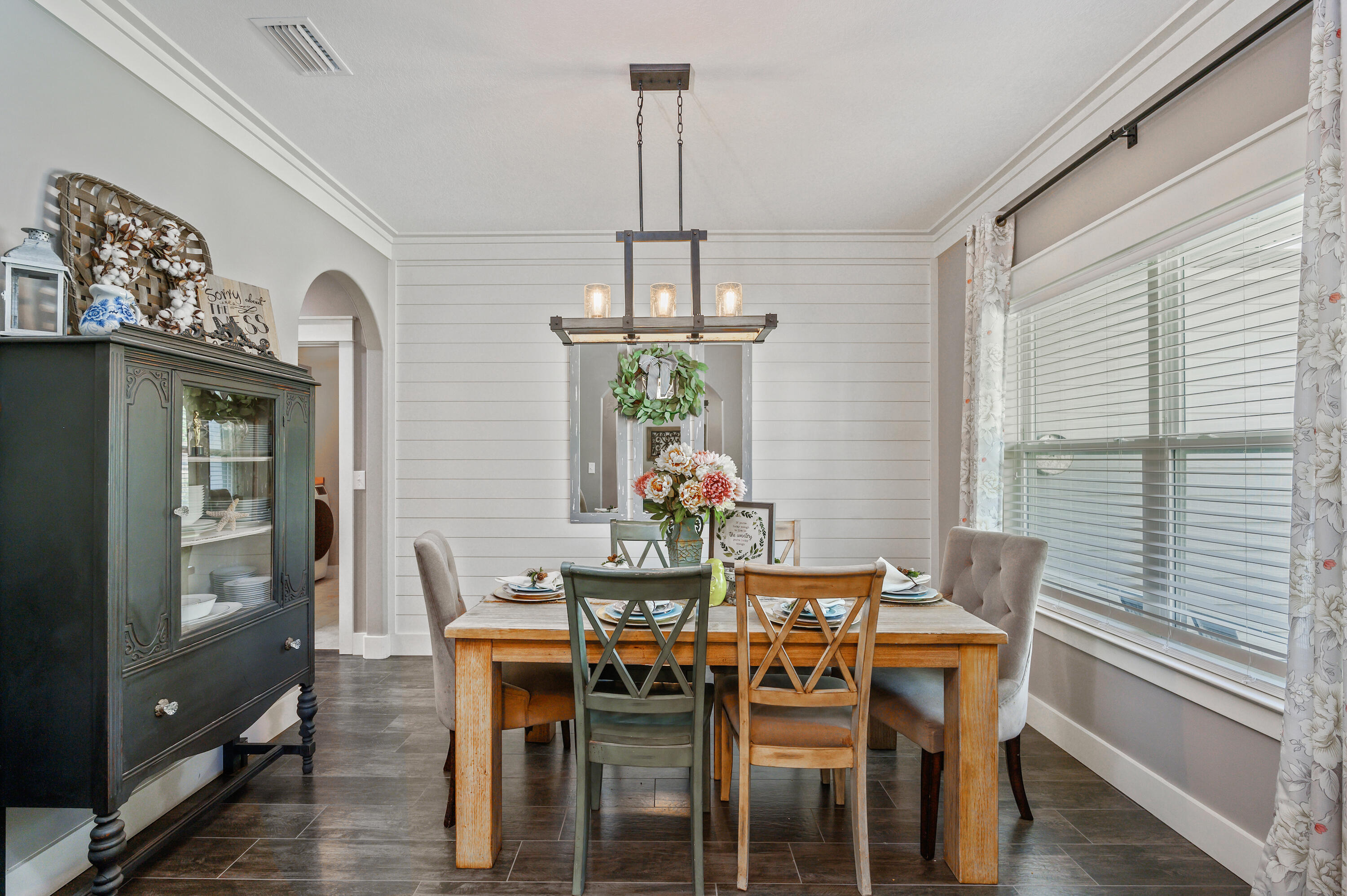 6053 Dairy Road Baker, FL 32531 - Photo 14 of 55 a view of a dining room with furniture window and wooden floor