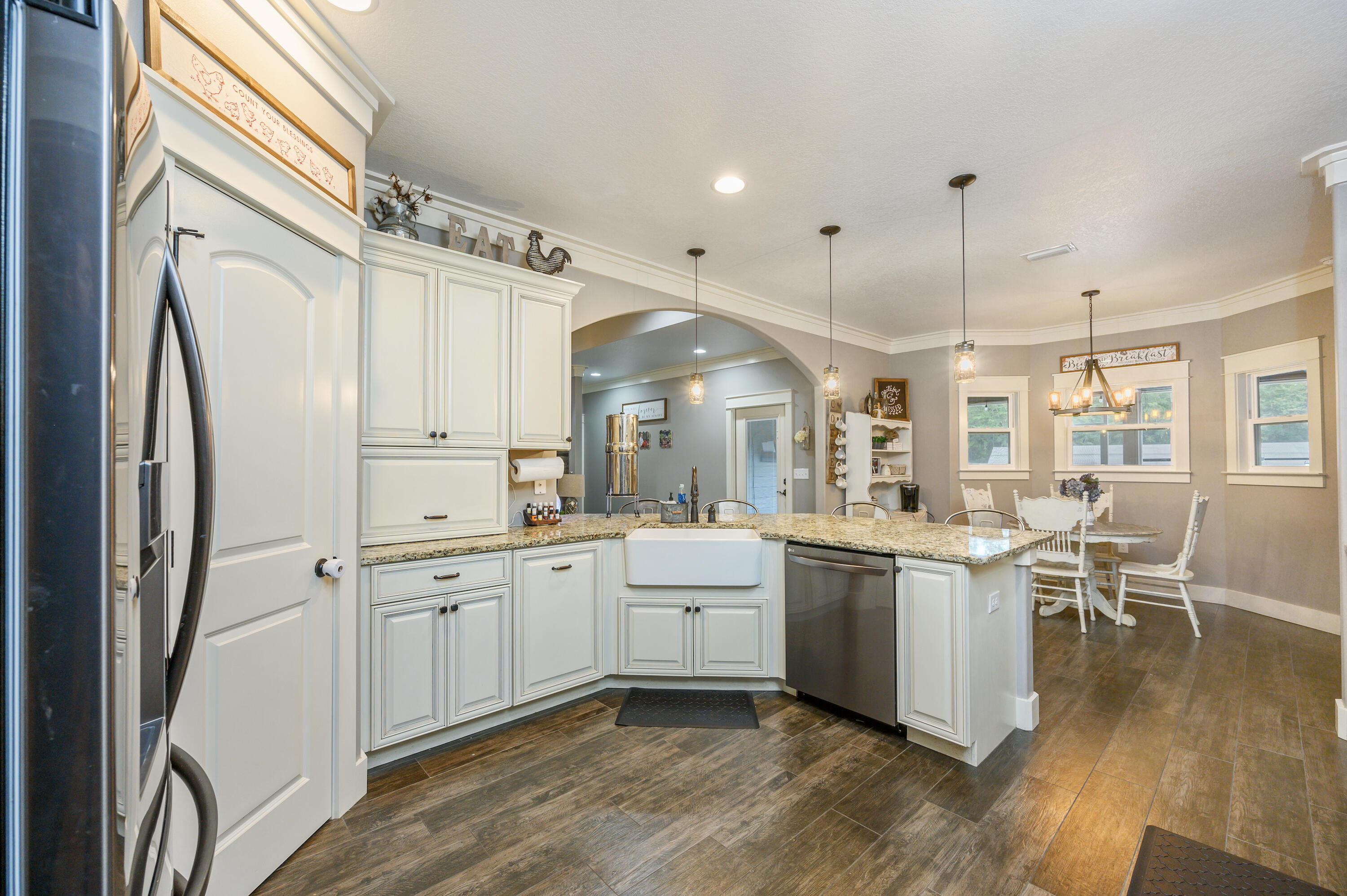 6053 Dairy Road Baker, FL 32531 - Photo 19 of 55 a kitchen with white cabinets and stainless steel appliances
