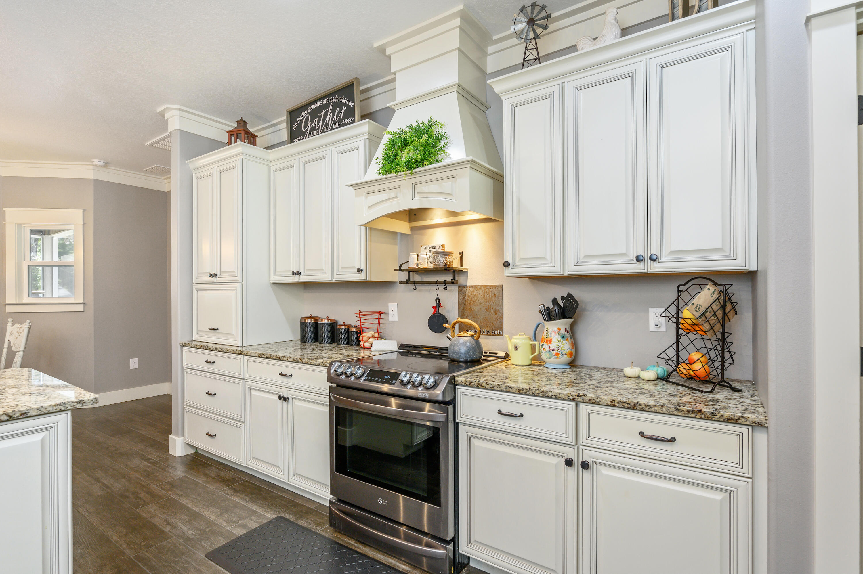 6053 Dairy Road Baker, FL 32531 - Photo 20 of 55 a kitchen with granite countertop white cabinets and white appliances