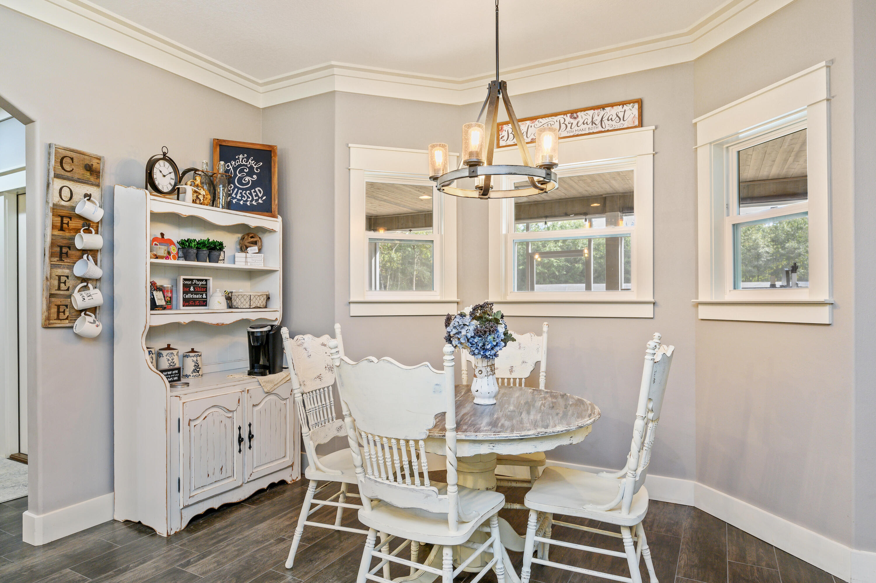 6053 Dairy Road Baker, FL 32531 - Photo 21 of 55 a dining room with furniture a chandelier and window