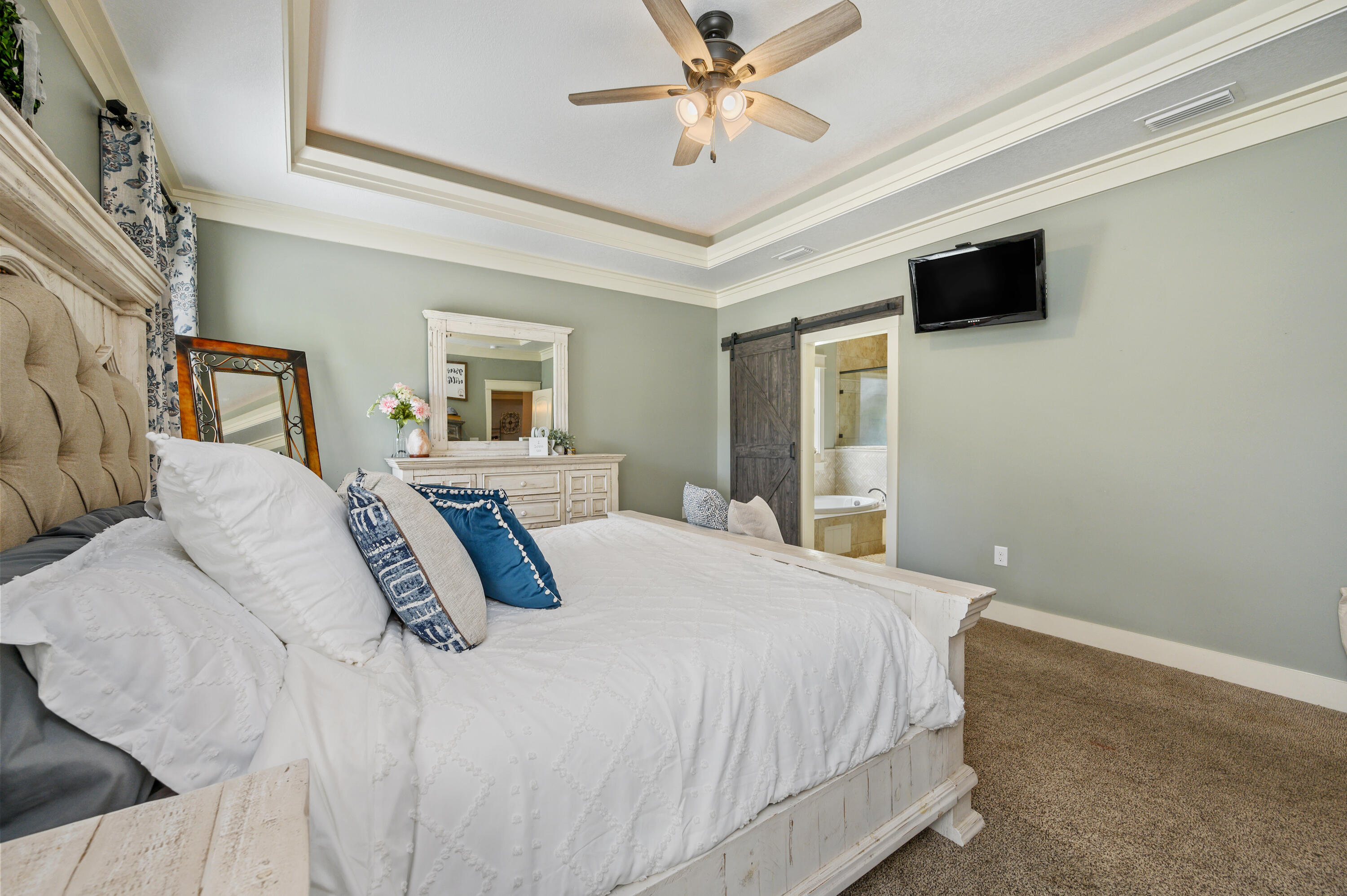 6053 Dairy Road Baker, FL 32531 - Photo 24 of 55 a bedroom with a large bed and a window