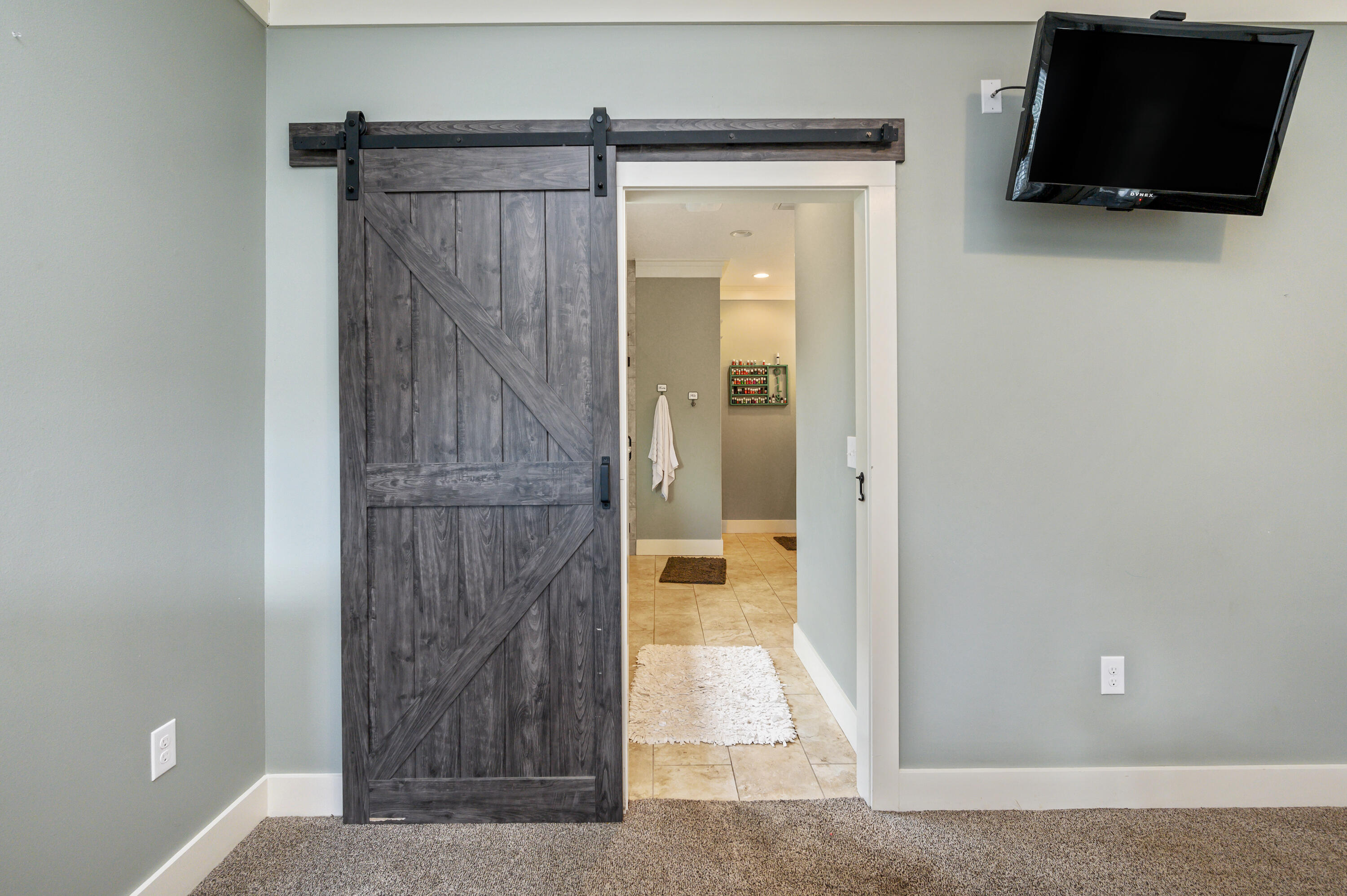6053 Dairy Road Baker, FL 32531 - Photo 25 of 55 a view of bathroom with a shower and a mirror