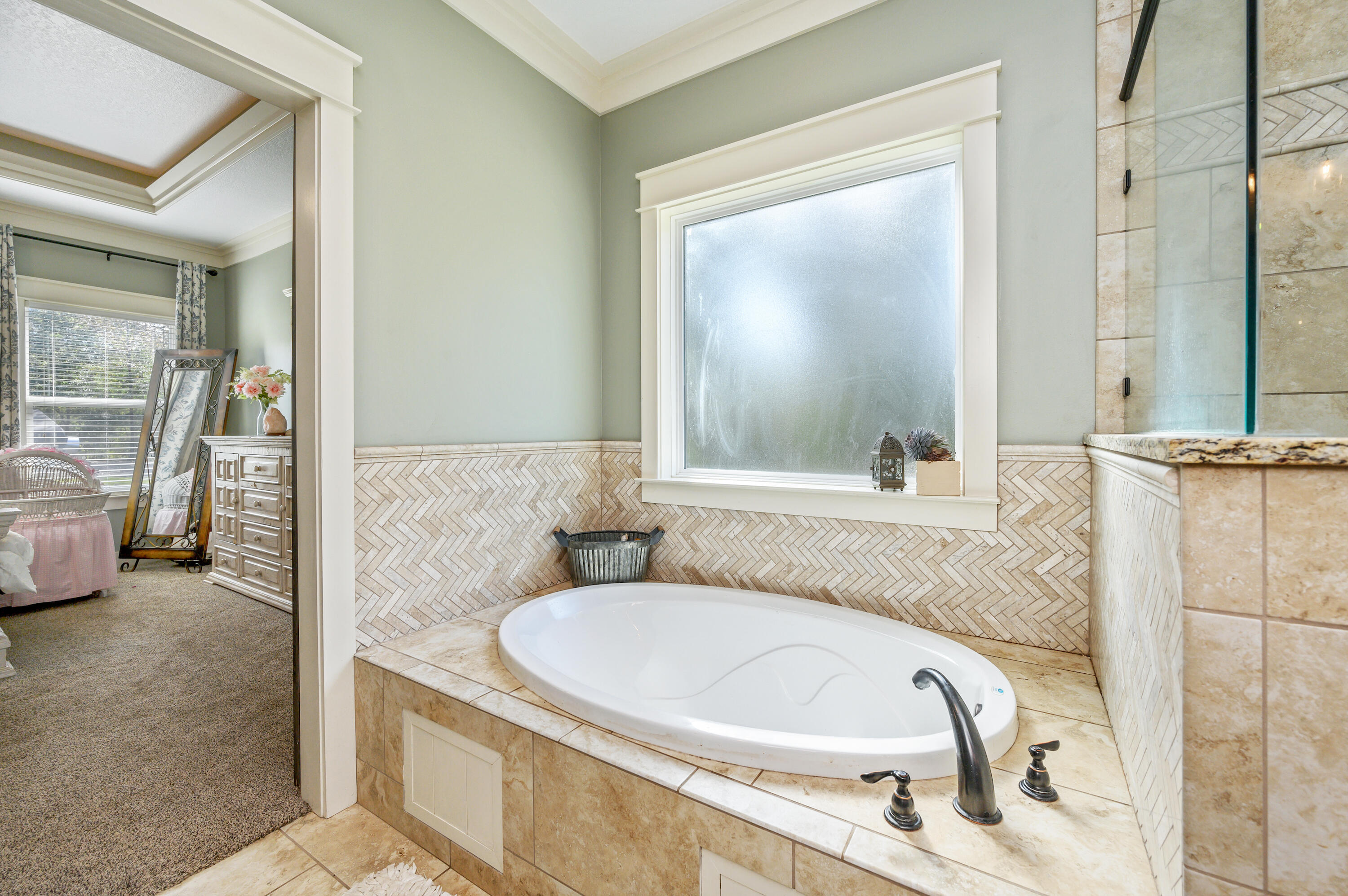 6053 Dairy Road Baker, FL 32531 - Photo 27 of 55 a bathroom with a granite countertop tub sink and mirror