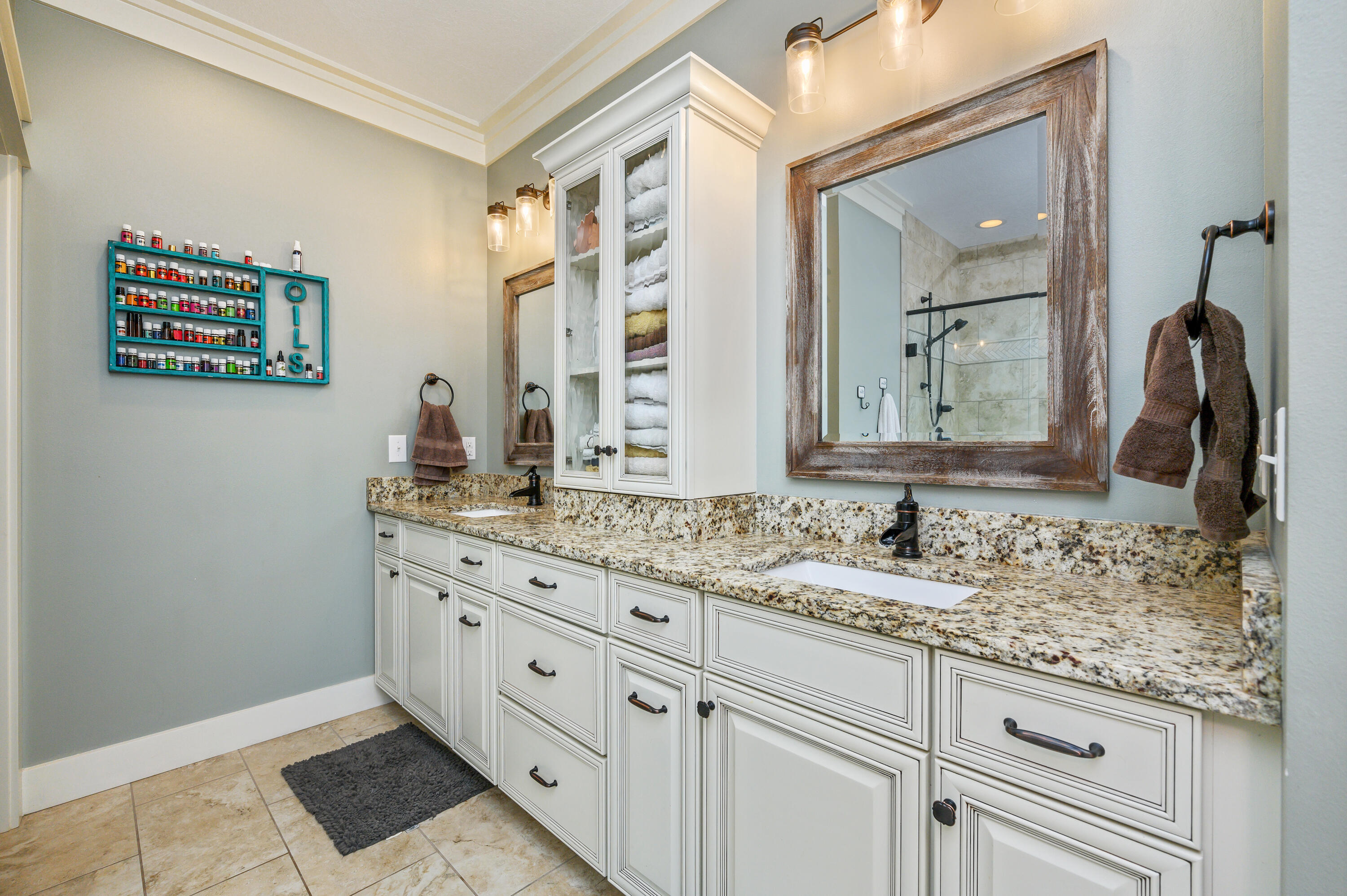 6053 Dairy Road Baker, FL 32531 - Photo 29 of 55 a bathroom with a granite countertop sink and a mirror