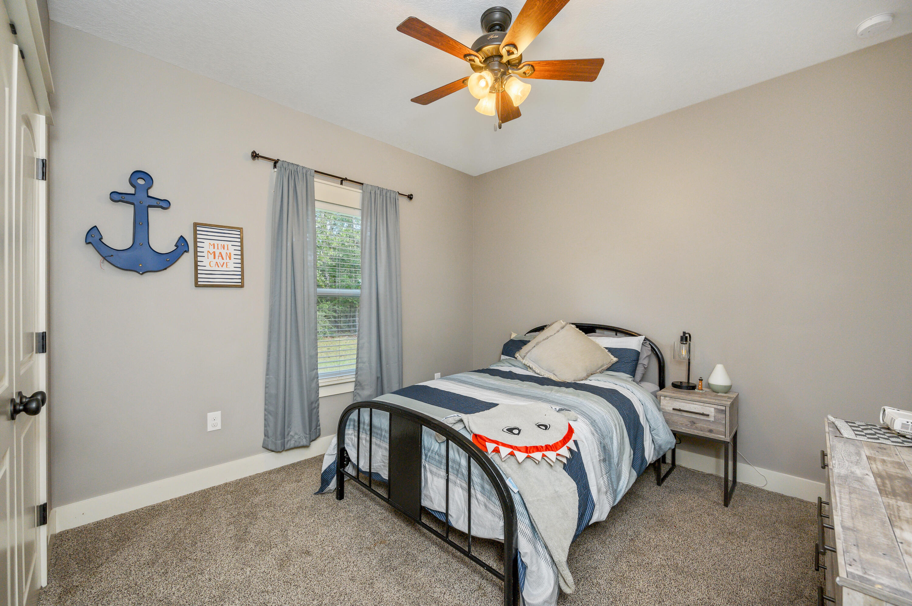 6053 Dairy Road Baker, FL 32531 - Photo 30 of 55 a bedroom with a bed and a window