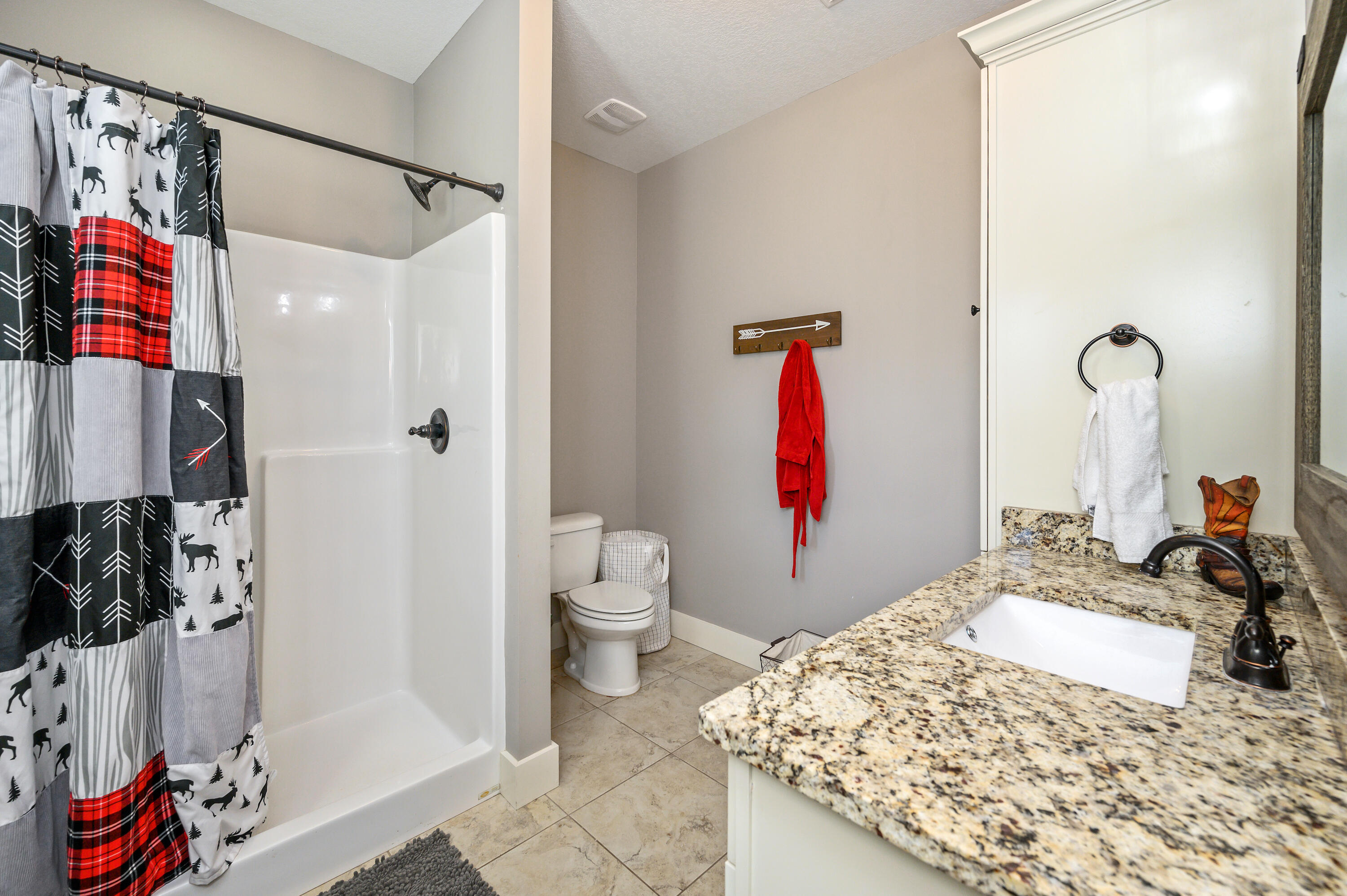6053 Dairy Road Baker, FL 32531 - Photo 35 of 55 a bathroom with a sink toilet and shower