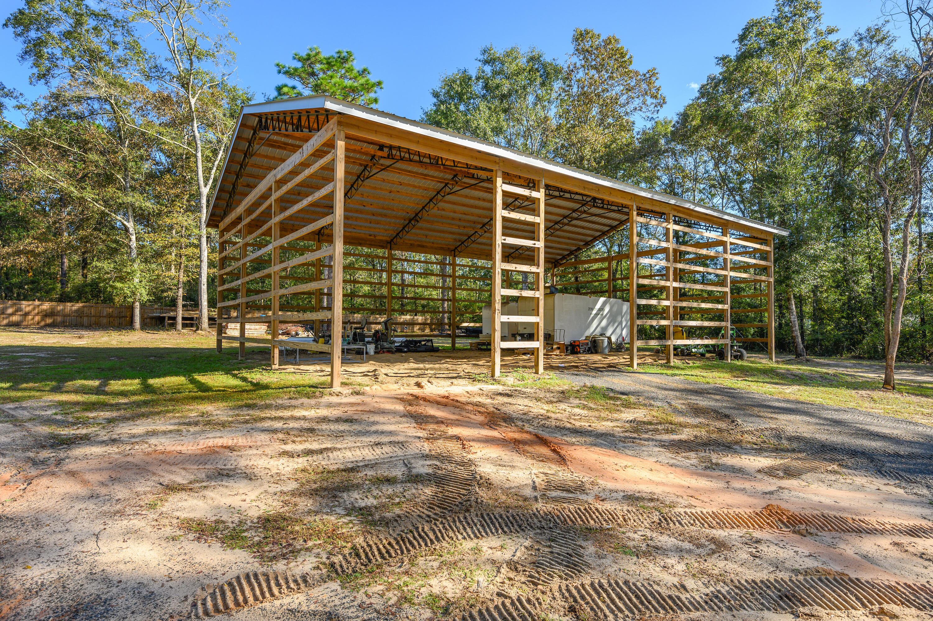 6053 Dairy Road Baker, FL 32531 - Photo 40 of 55 a view of a house with a backyard