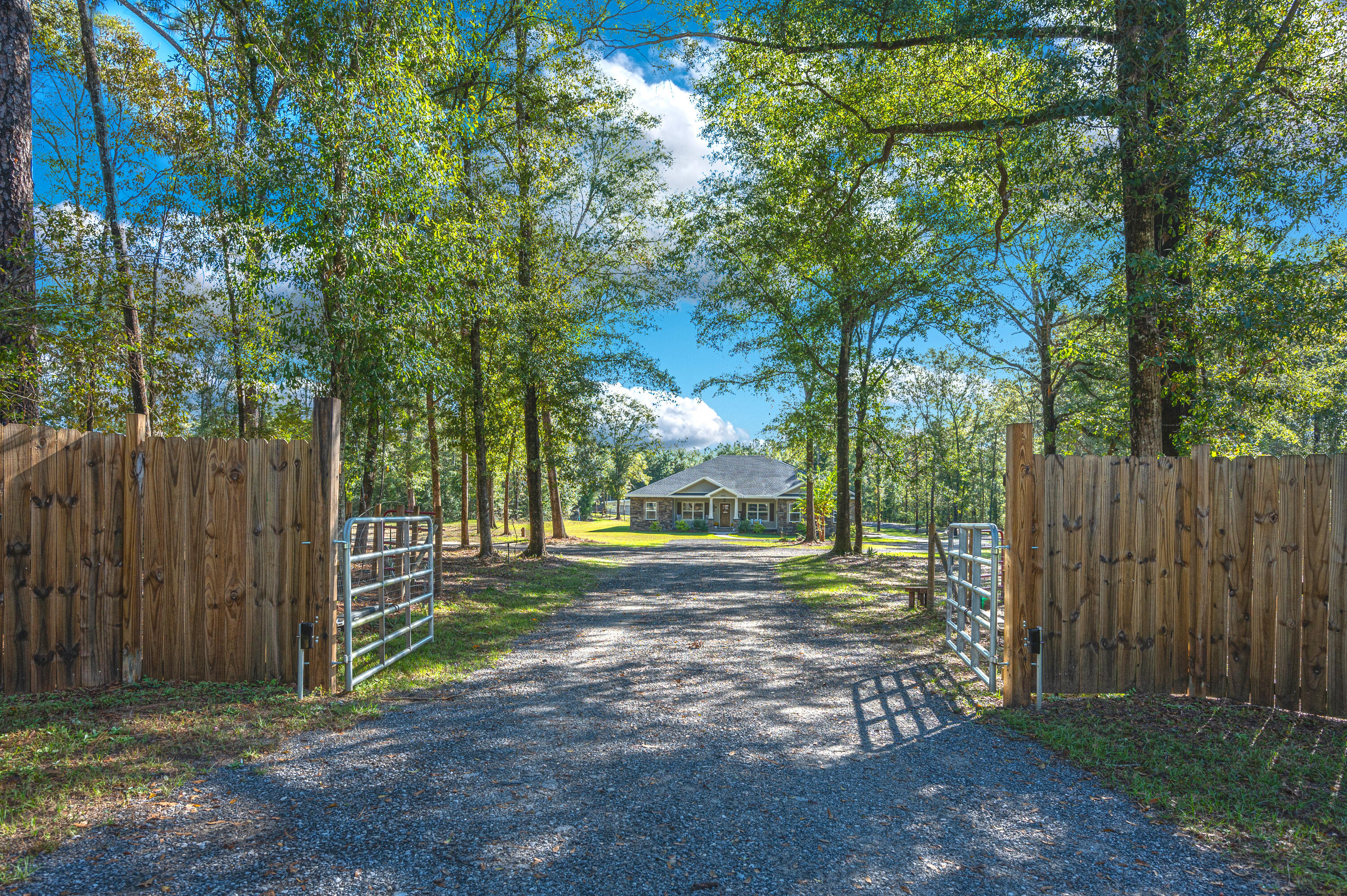 6053 Dairy Road Baker, FL 32531 - Photo 5 of 55 a view of a yard with wooden fence
