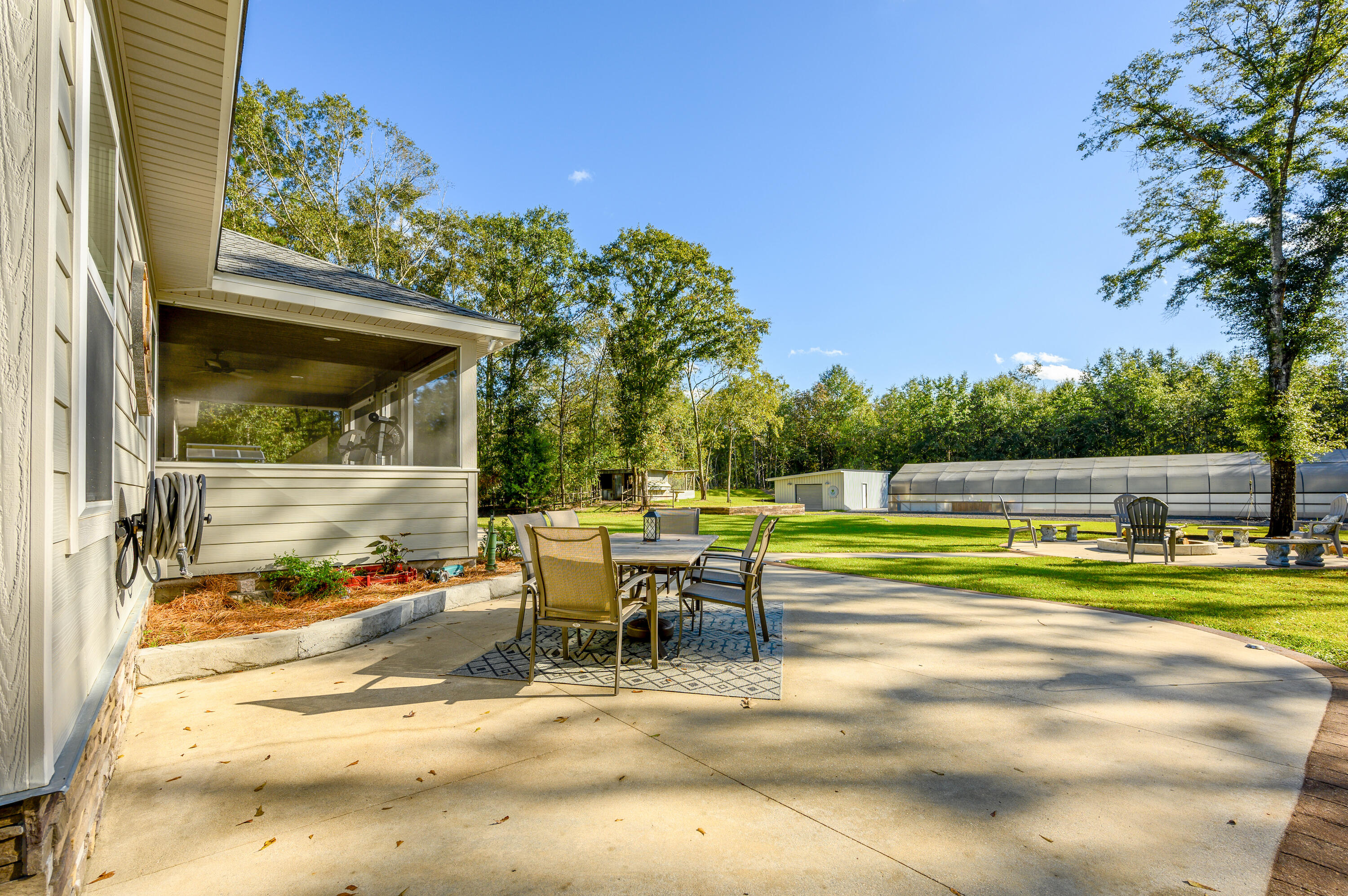 6053 Dairy Road Baker, FL 32531 - Photo 41 of 55 a view of a swimming pool with a patio