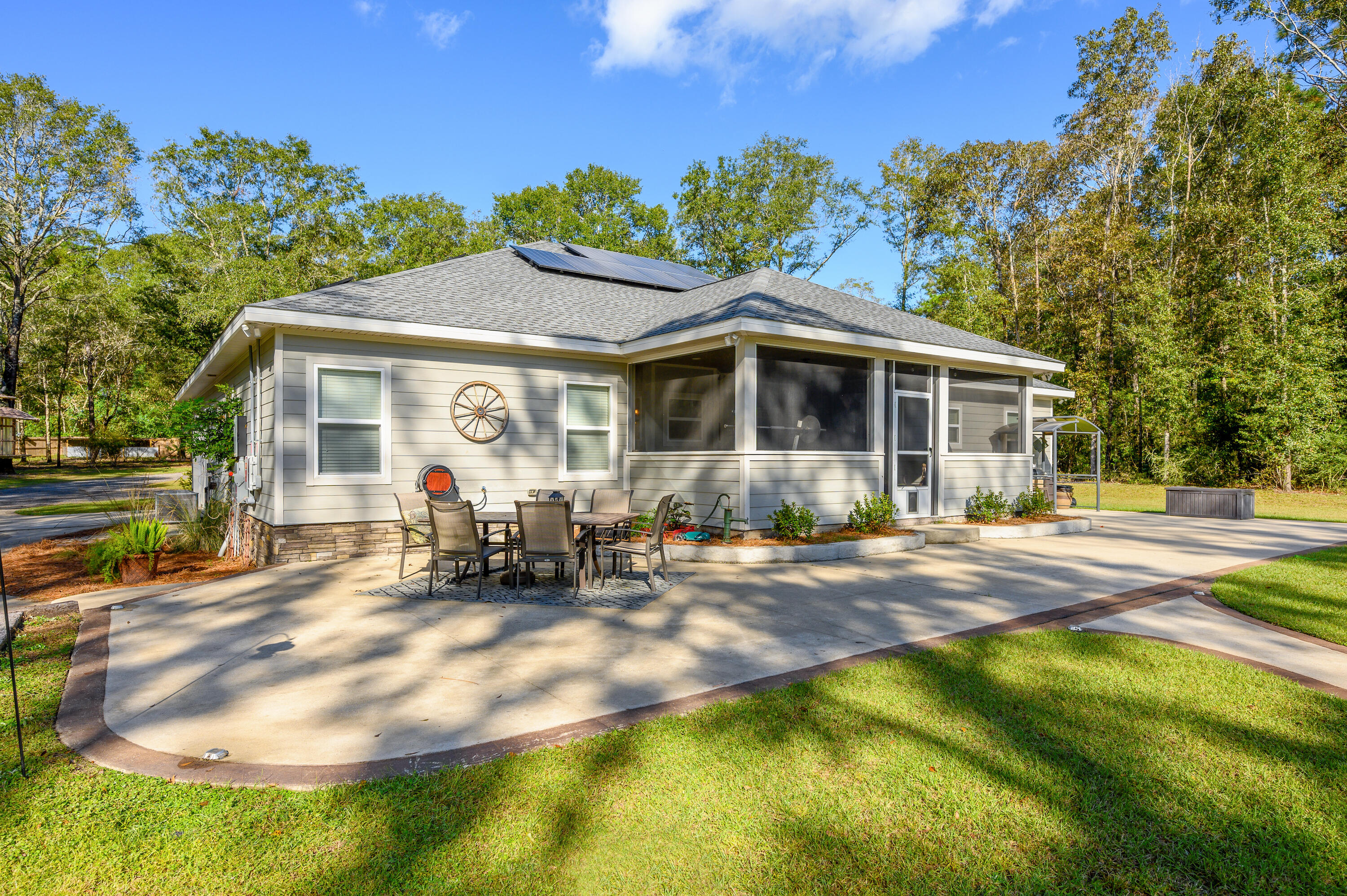 6053 Dairy Road Baker, FL 32531 - Photo 42 of 55 a view of a house with backyard