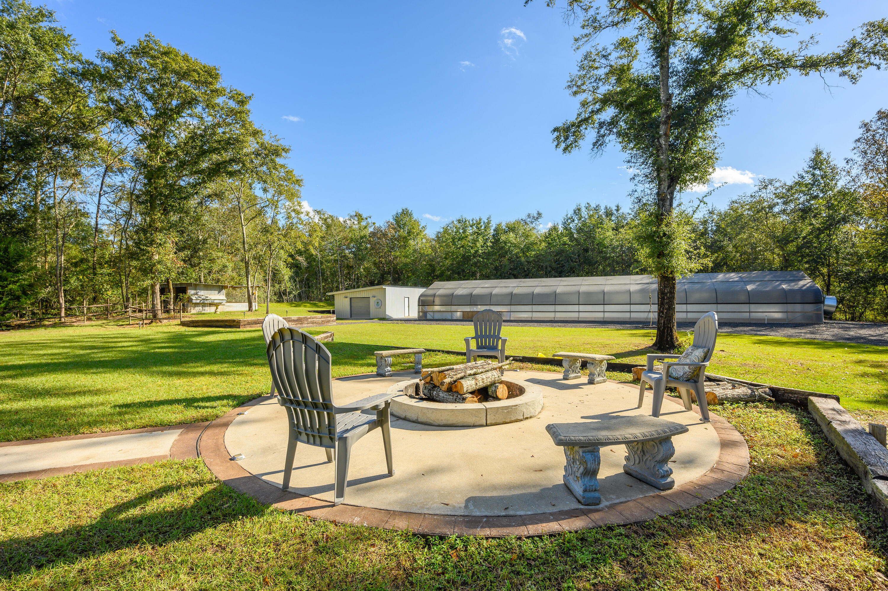 6053 Dairy Road Baker, FL 32531 - Photo 43 of 55 a view of a swimming pool and lounge chairs
