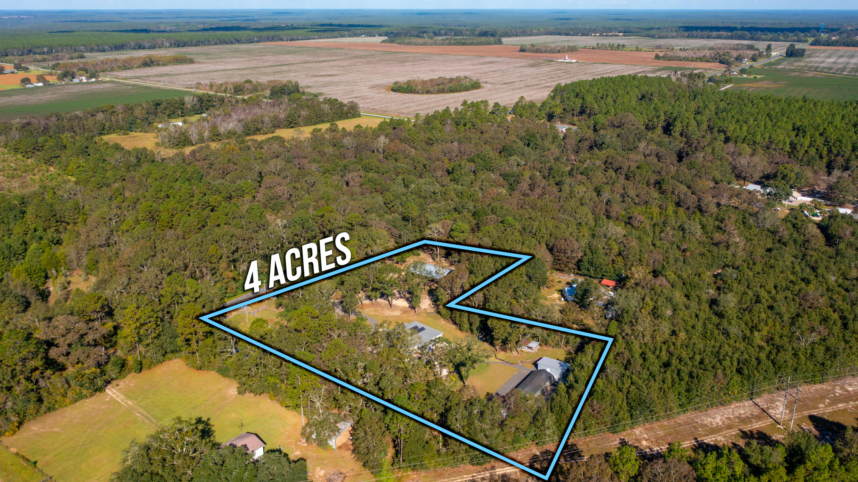 6053 Dairy Road Baker, FL 32531 - Photo 52 of 55 a view of a big yard with wooden floor