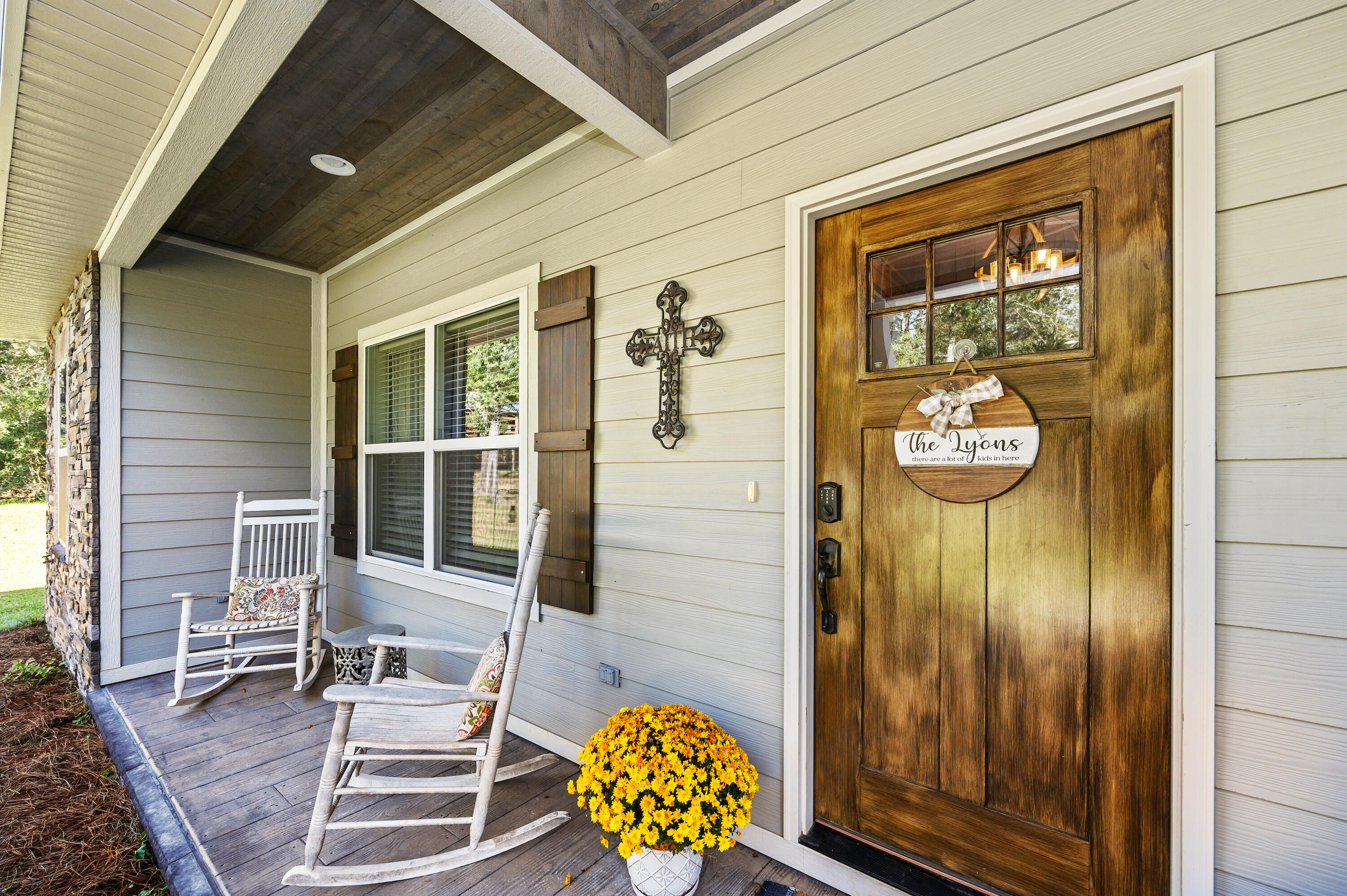 6053 Dairy Road Baker, FL 32531 - Photo 8 of 55 a view of porch with a table and chairs and potted plants