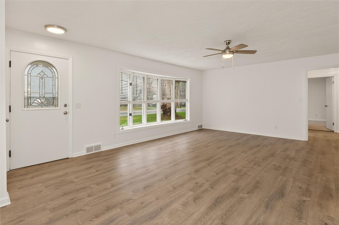 667 Hard Road Webster, NY 14580 - Photo 12 of 45 Warm by fireplace and bright and sunny with large