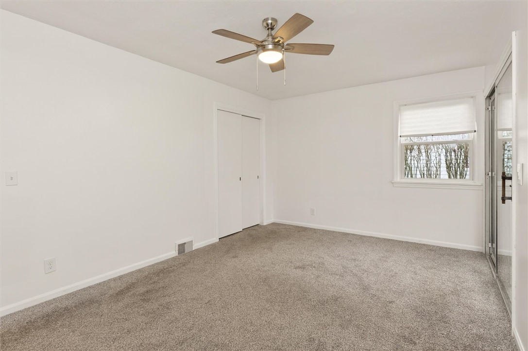 667 Hard Road Webster, NY 14580 - Photo 22 of 45 Master bedroom with double closet in corner.