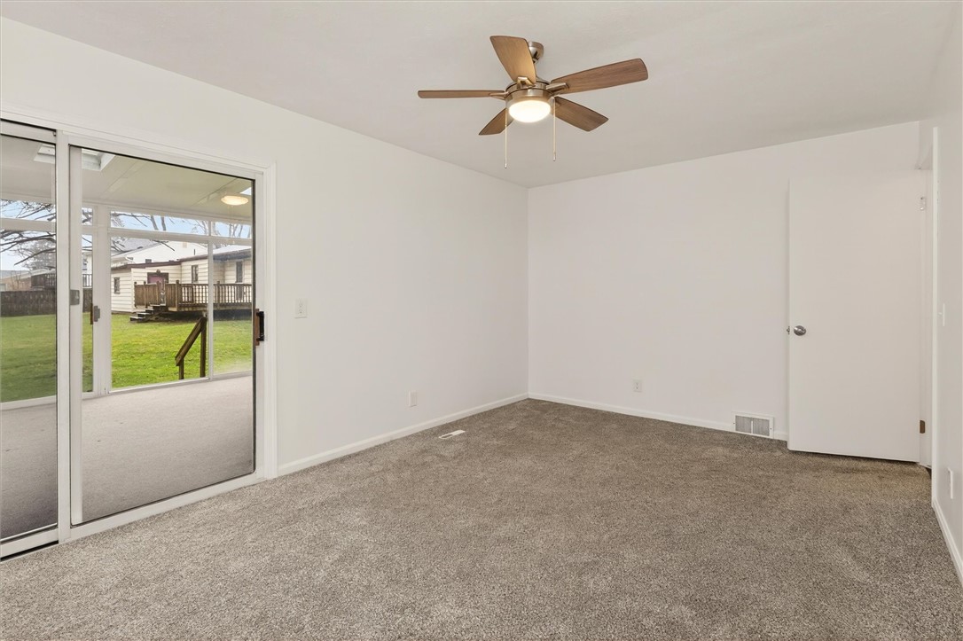 667 Hard Road Webster, NY 14580 - Photo 23 of 45 SGD's in master leading to 3 season room.