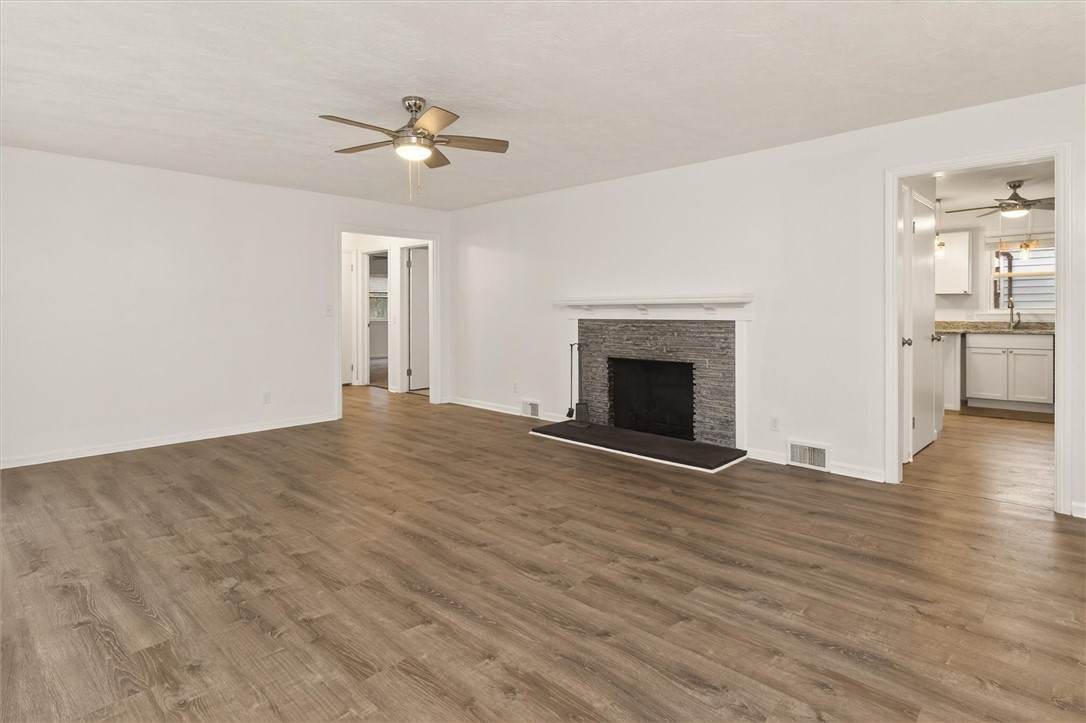 667 Hard Road Webster, NY 14580 - Photo 9 of 45 Wood Burning Fireplace in center of living room fr