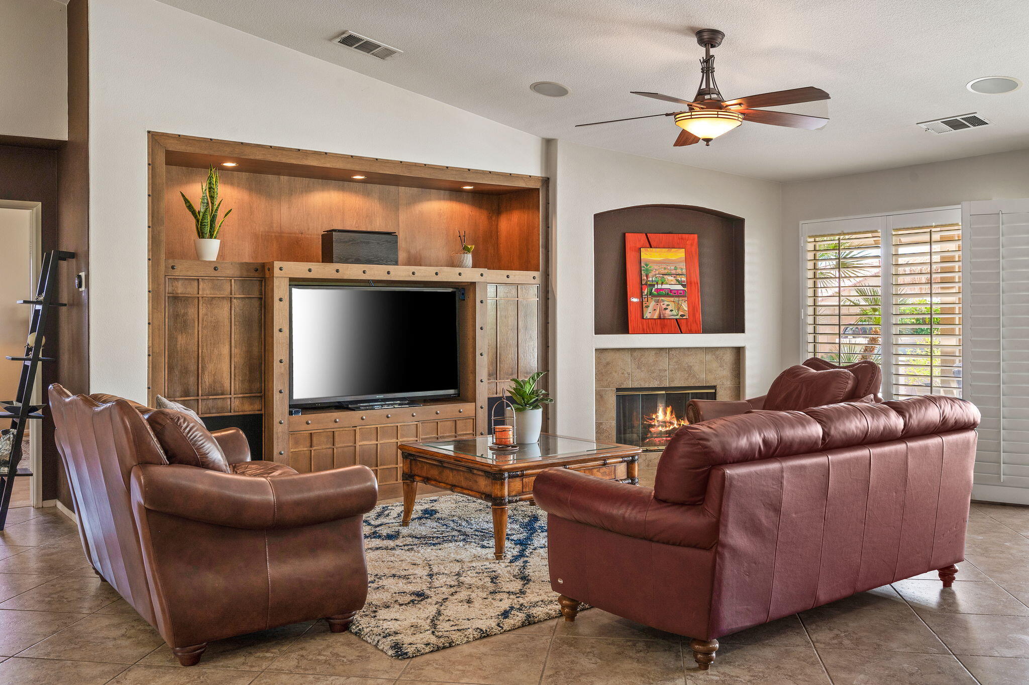 83414 Greenbrier Drive Indio, CA 92203 - Photo 11 of 43 a living room with furniture a large window and a flat screen tv