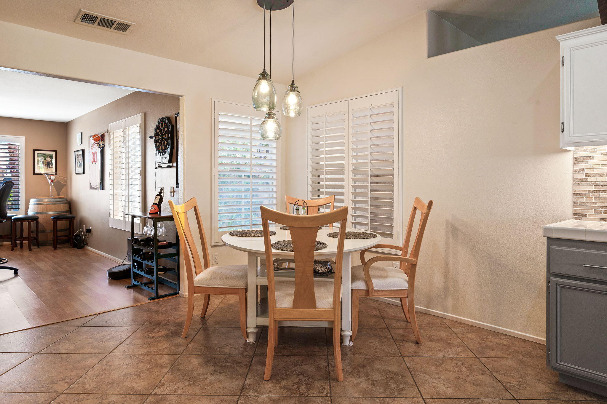 83414 Greenbrier Drive Indio, CA 92203 - Photo 18 of 43 a view of a dining room with furniture and a chandelier