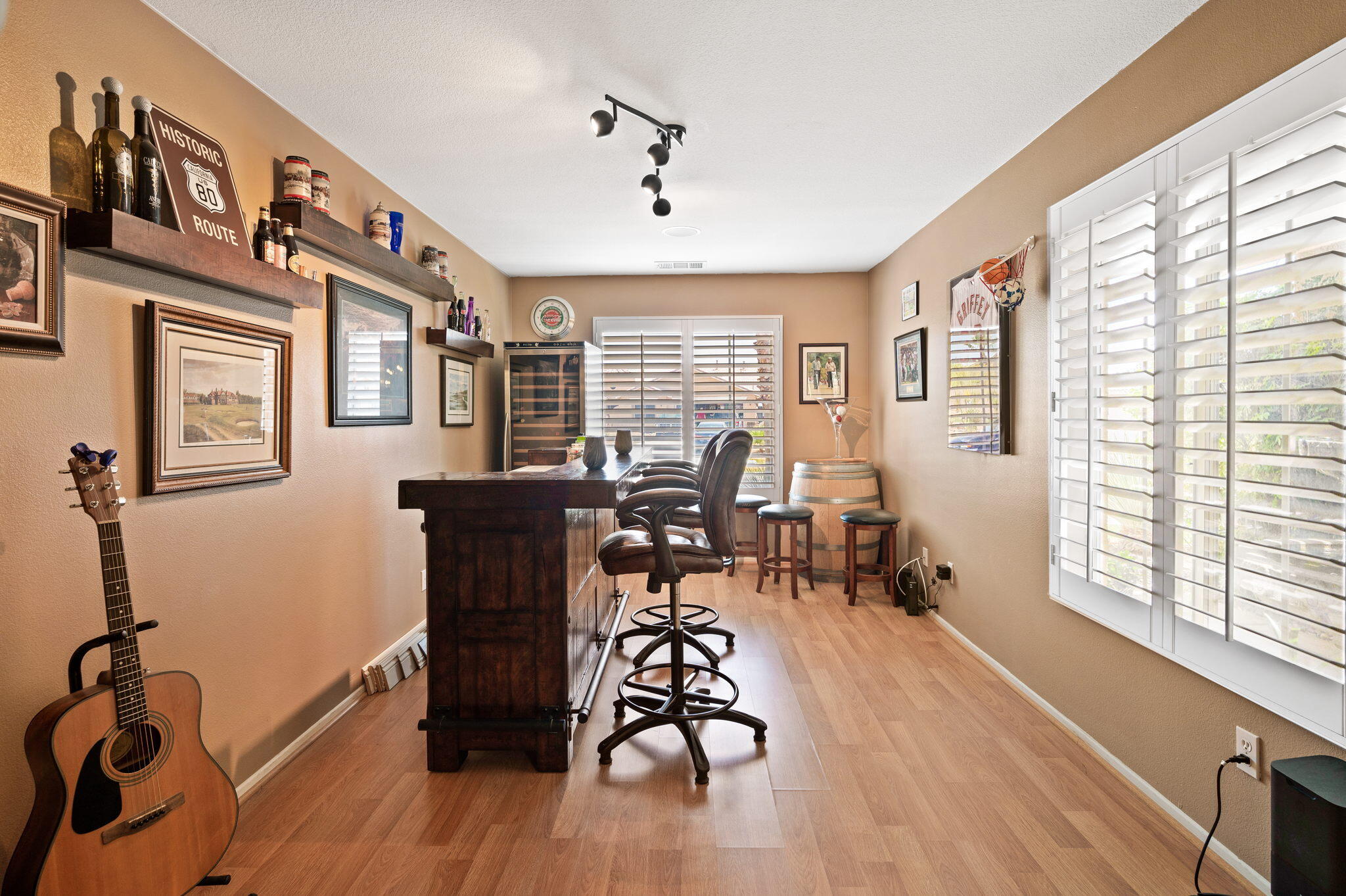 83414 Greenbrier Drive Indio, CA 92203 - Photo 19 of 43 a view of a livingroom with furniture wooden floor and windows