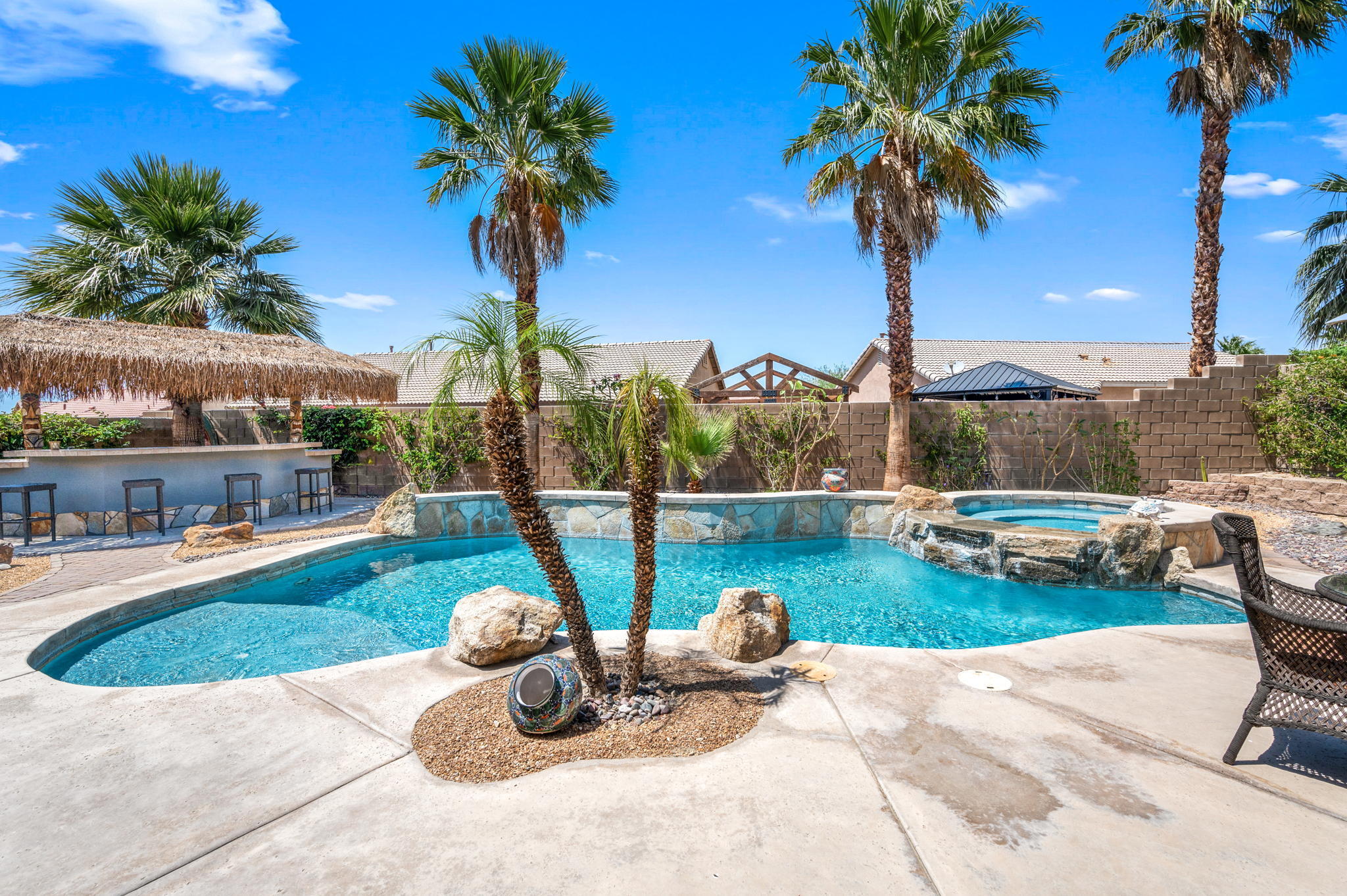 83414 Greenbrier Drive Indio, CA 92203 - Photo 2 of 43 a view of a backyard with swimming pool and plants