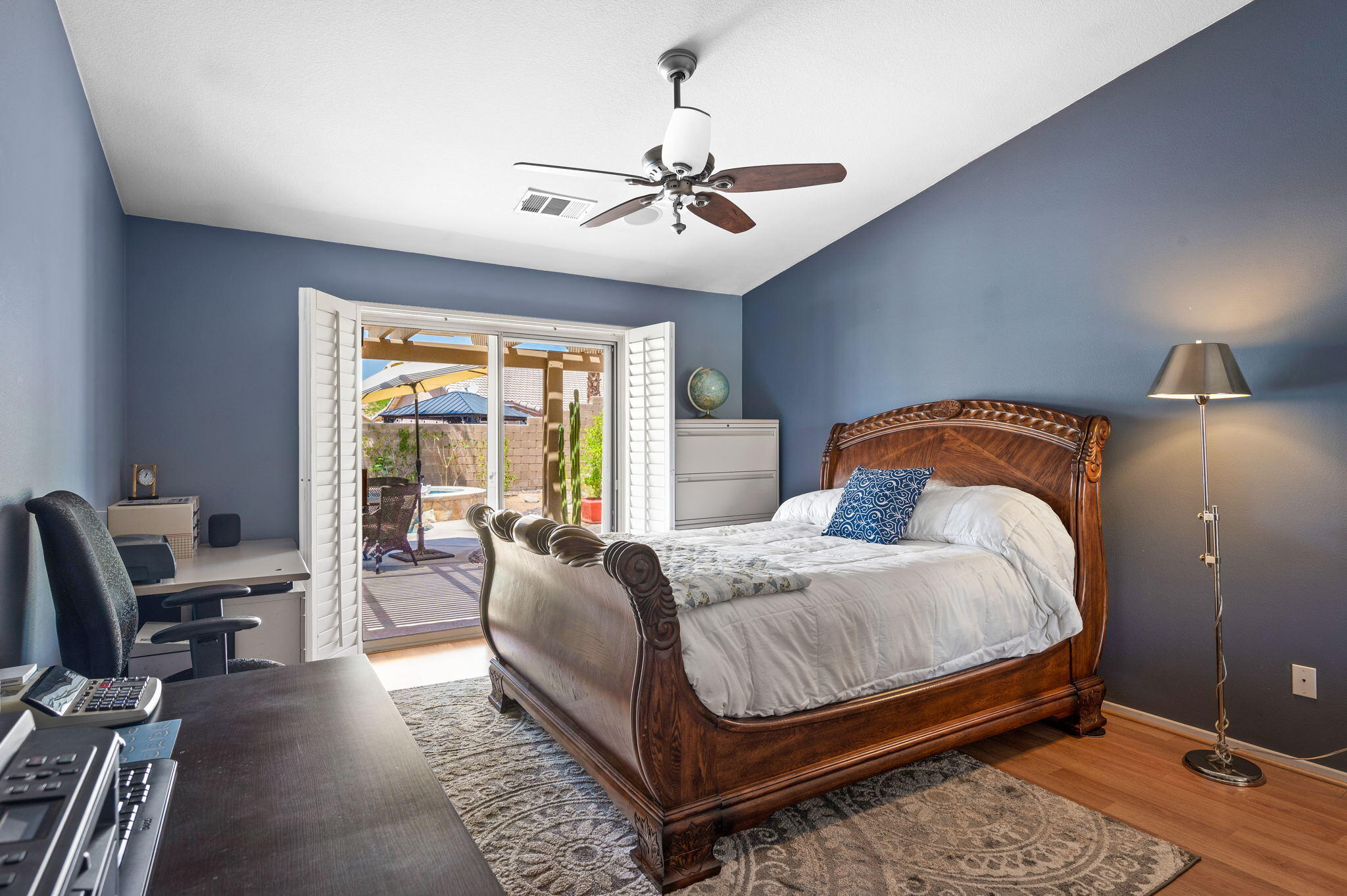 83414 Greenbrier Drive Indio, CA 92203 - Photo 21 of 43 a bedroom with a bed and a chandelier