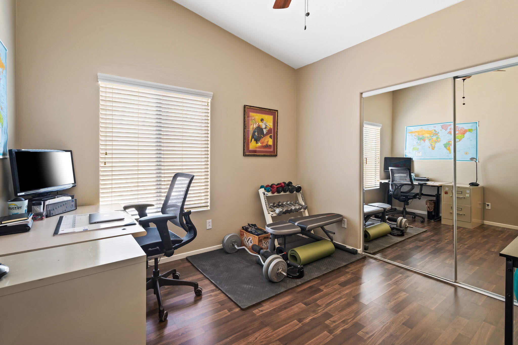 83414 Greenbrier Drive Indio, CA 92203 - Photo 24 of 43 a view of a workspace with wooden floor and a window