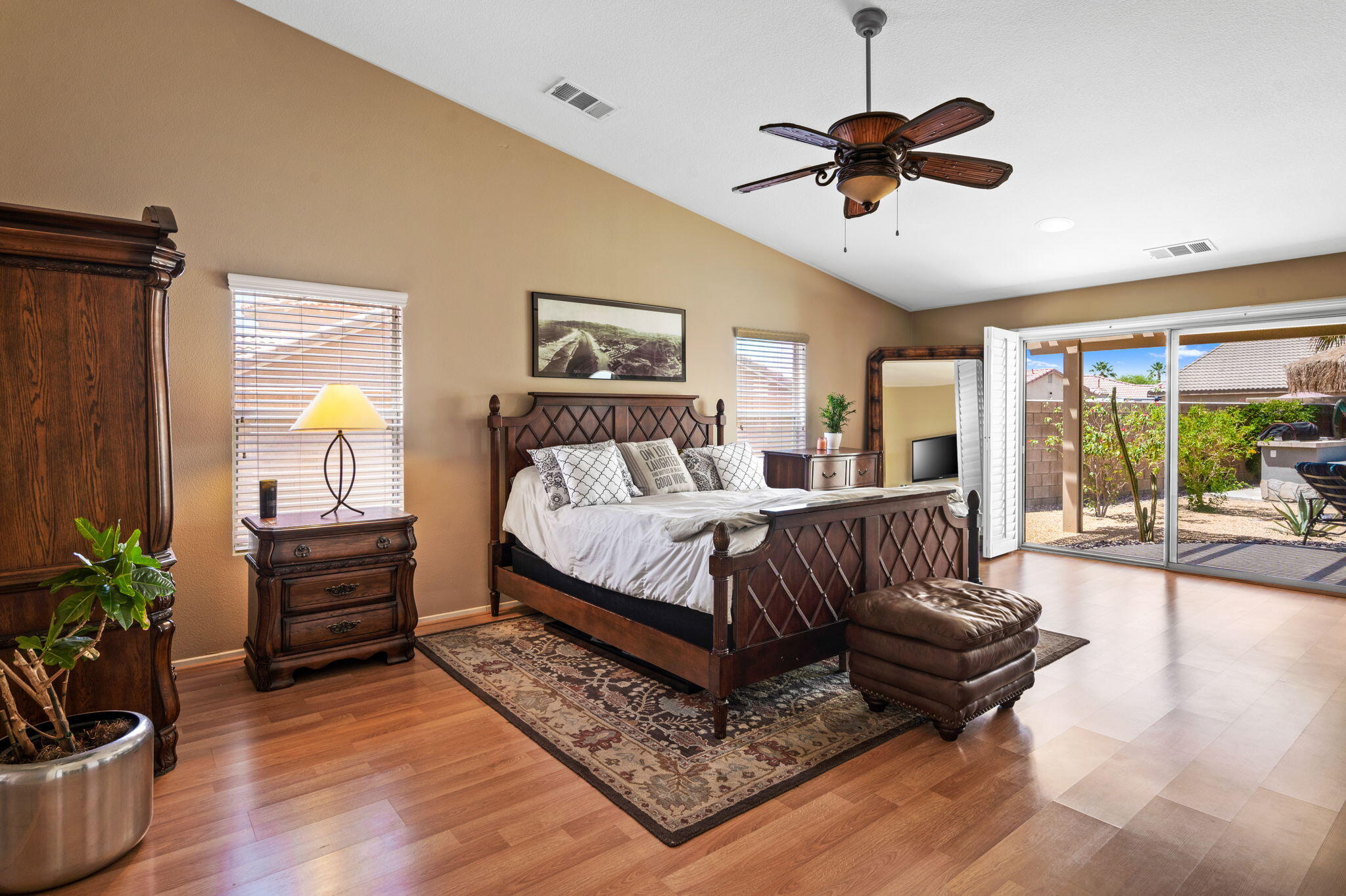 83414 Greenbrier Drive Indio, CA 92203 - Photo 25 of 43 a bedroom with a bed and wooden floor