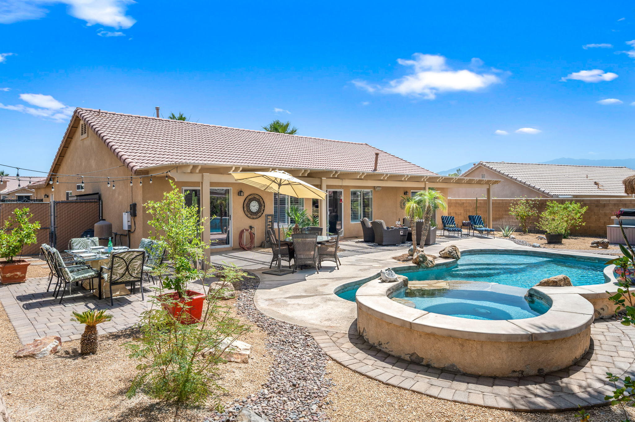 83414 Greenbrier Drive Indio, CA 92203 - Photo 33 of 43 a view of a house with swimming pool and sitting area